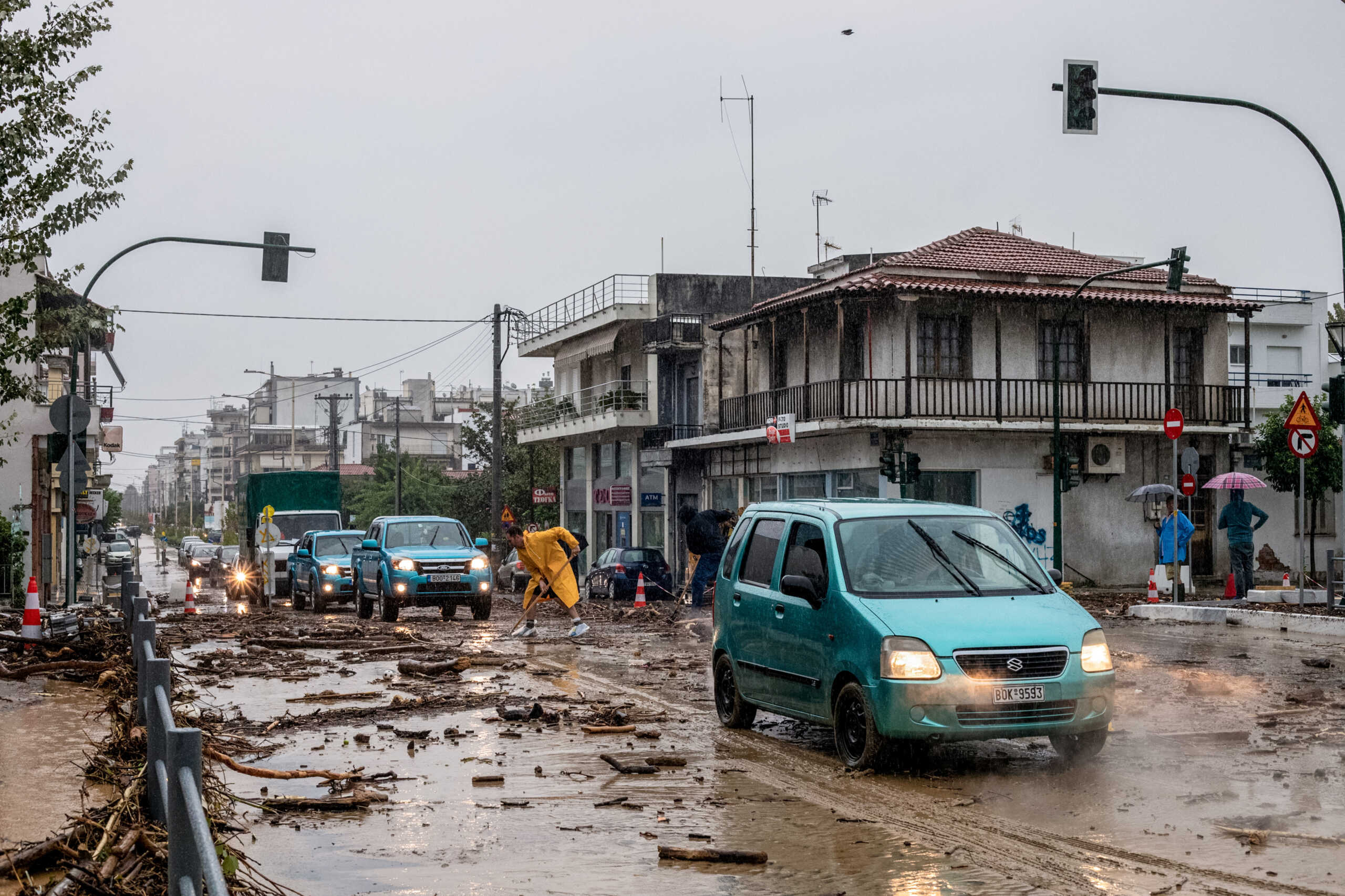 Cars drive among debris and mud, following a flash flood during a storm in the city of Volos, Greece, September 5, 2023. Anastasia Karekla