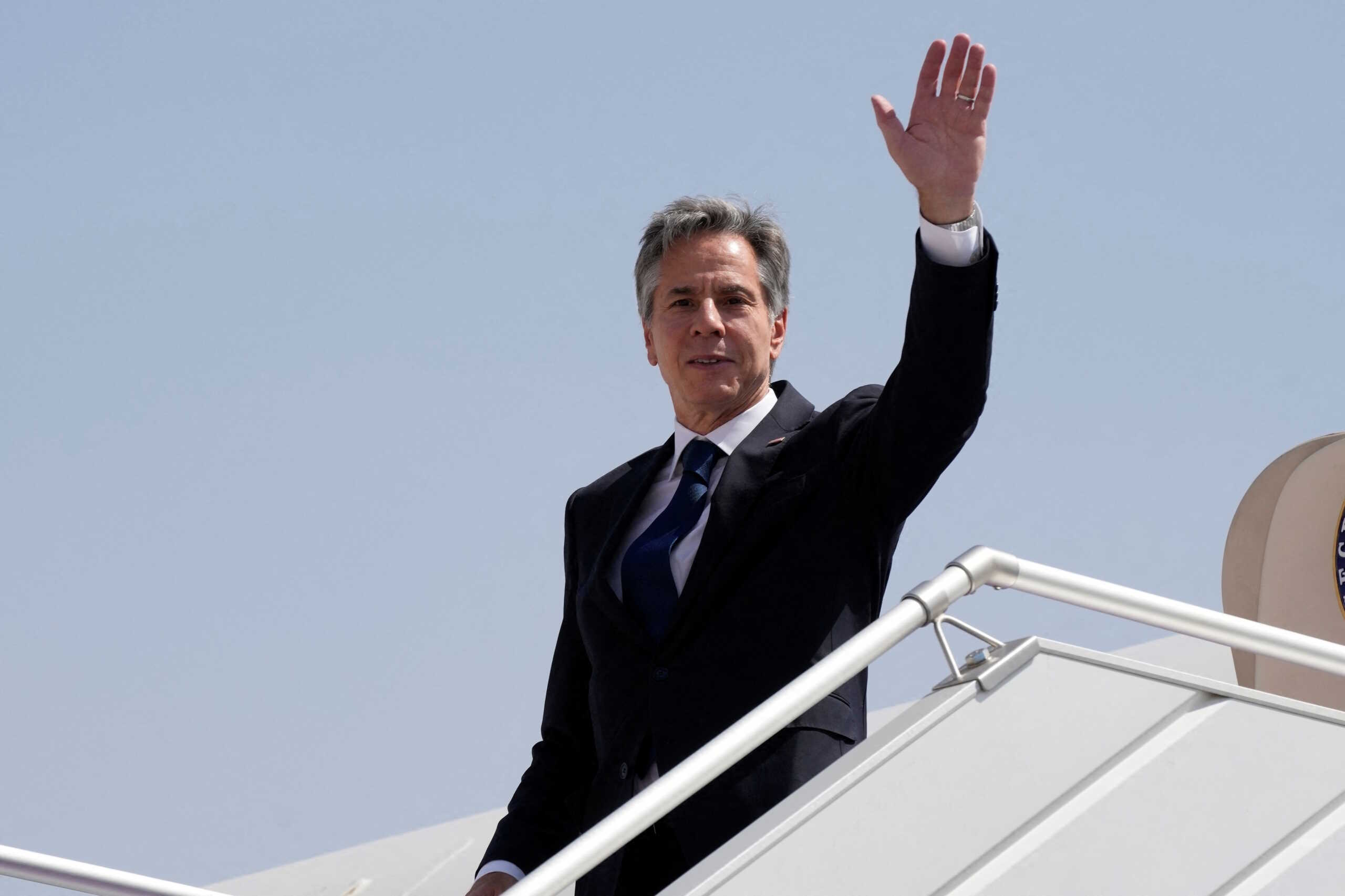 U.S. Secretary of State Antony Blinken waves as he boards a plane leaving Riyadh, Saudi Arabia, Oct. 15, 2023.     Jacquelyn Martin