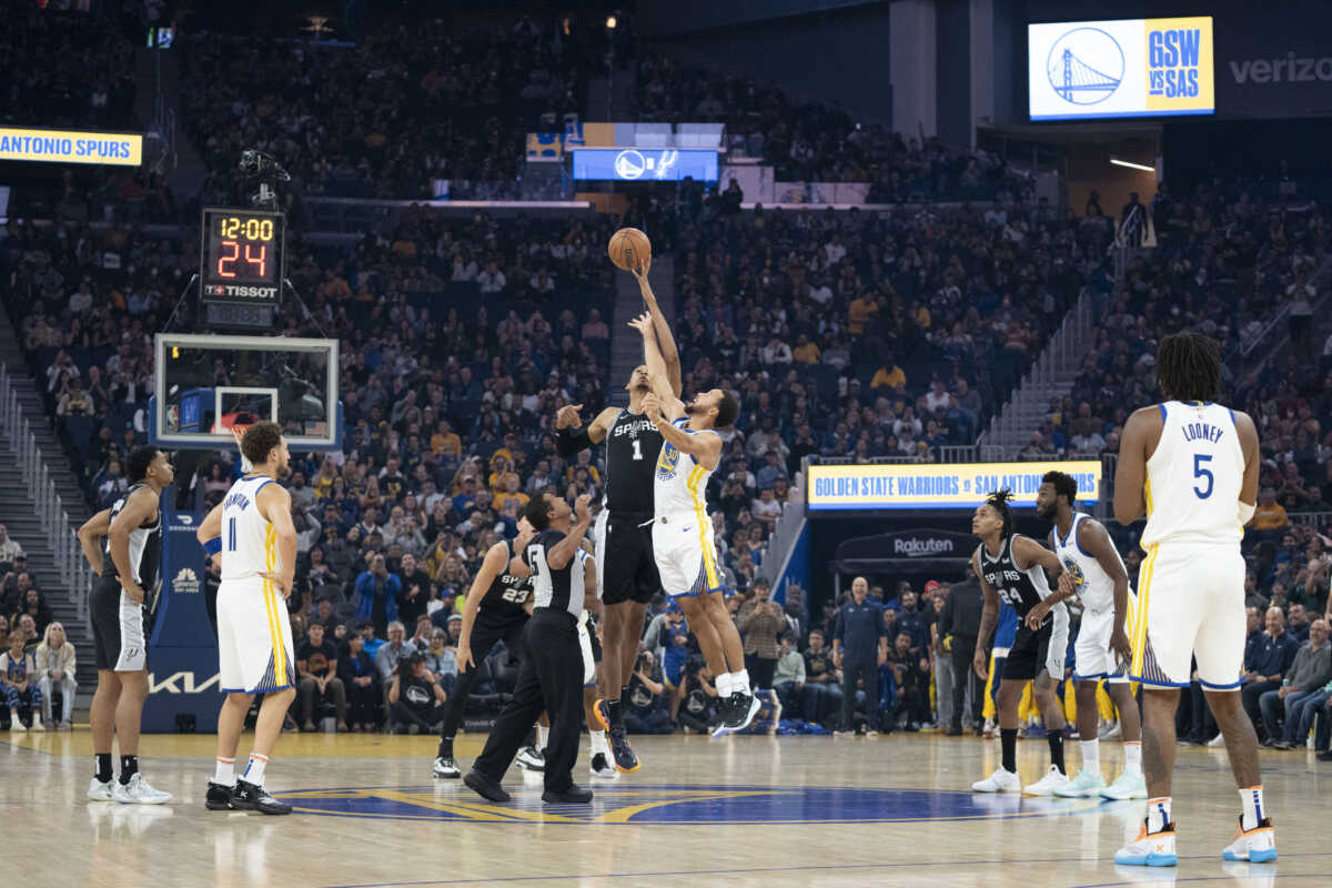 October 20, 2023; San Francisco, California, USA; San Antonio Spurs center Victor Wembanyama (1) and Golden State Warriors guard Stephen Curry (30) jump for the opening tipoff during the first quarter at Chase Center. Mandatory Credit: Kyle Terada-USA TODAY Sports