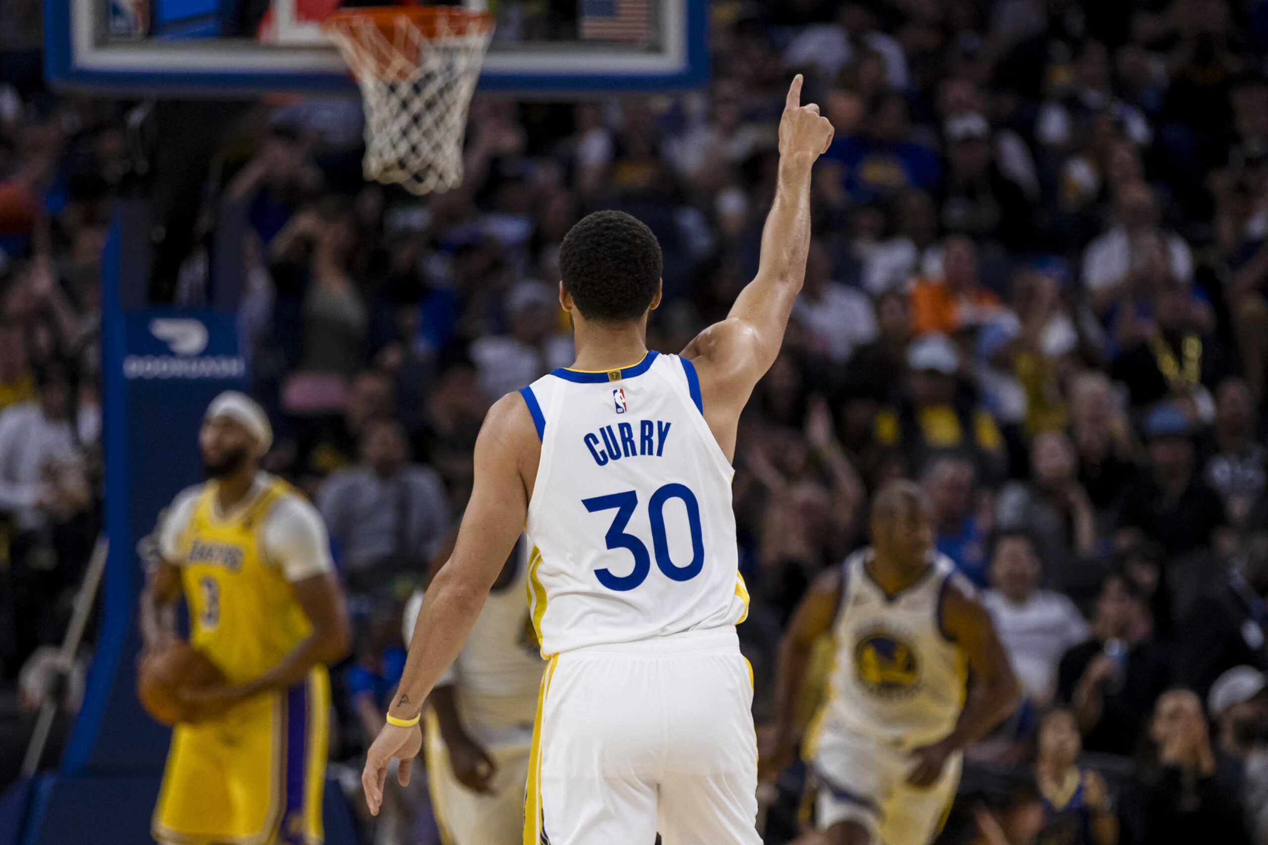 Oct 7, 2023; San Francisco, California, USA; Golden State Warriors guard Stephen Curry (30) gestures after guard Chris Paul (3) scored against the Los Angeles Lakers during the first half at Chase Center. Mandatory Credit: John Hefti-USA TODAY Sports