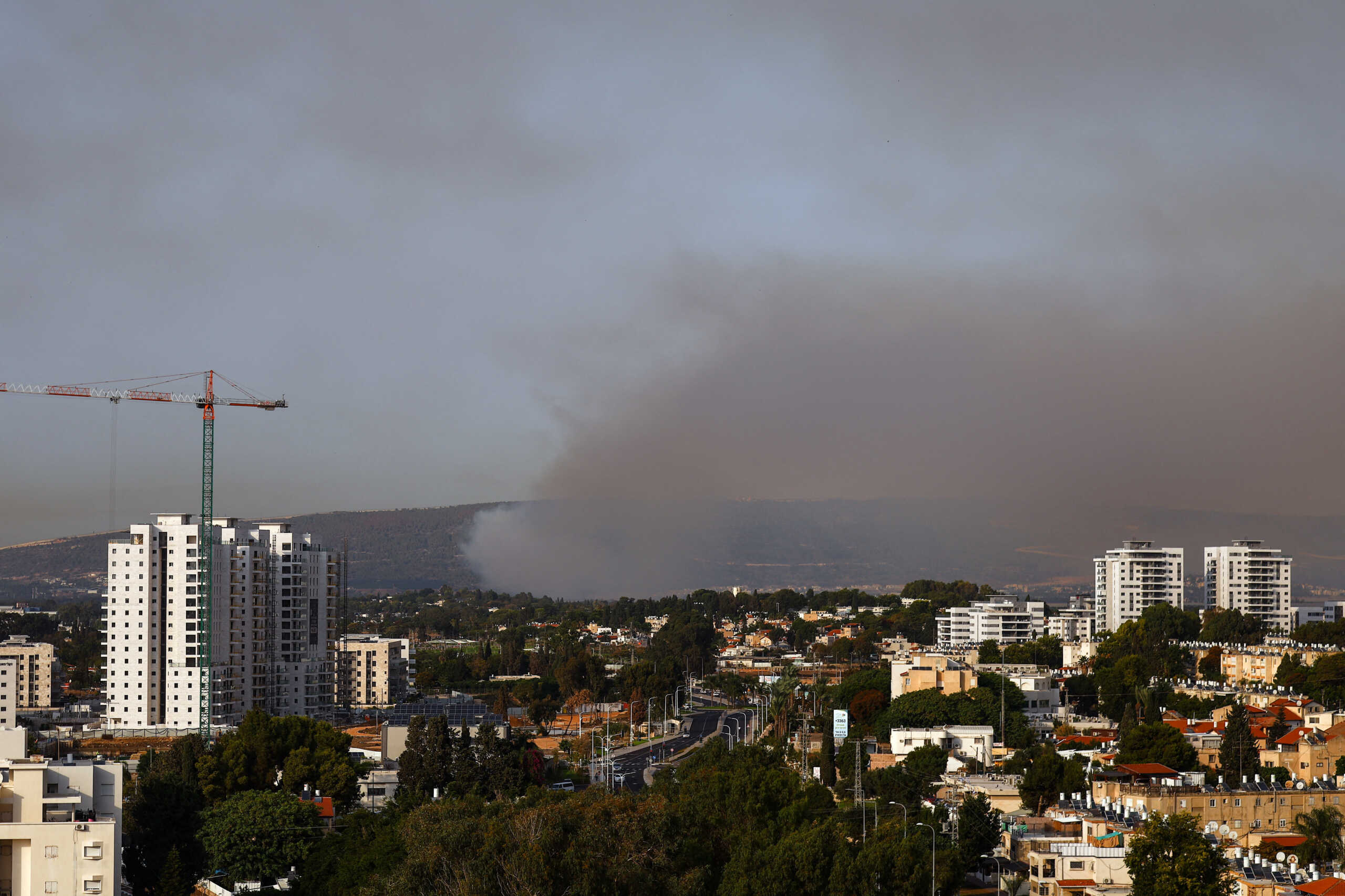 Smoke rises above Israel's border with Lebanon, as seen from Nahariya in northern Israel, October 22, 2023. REUTERS