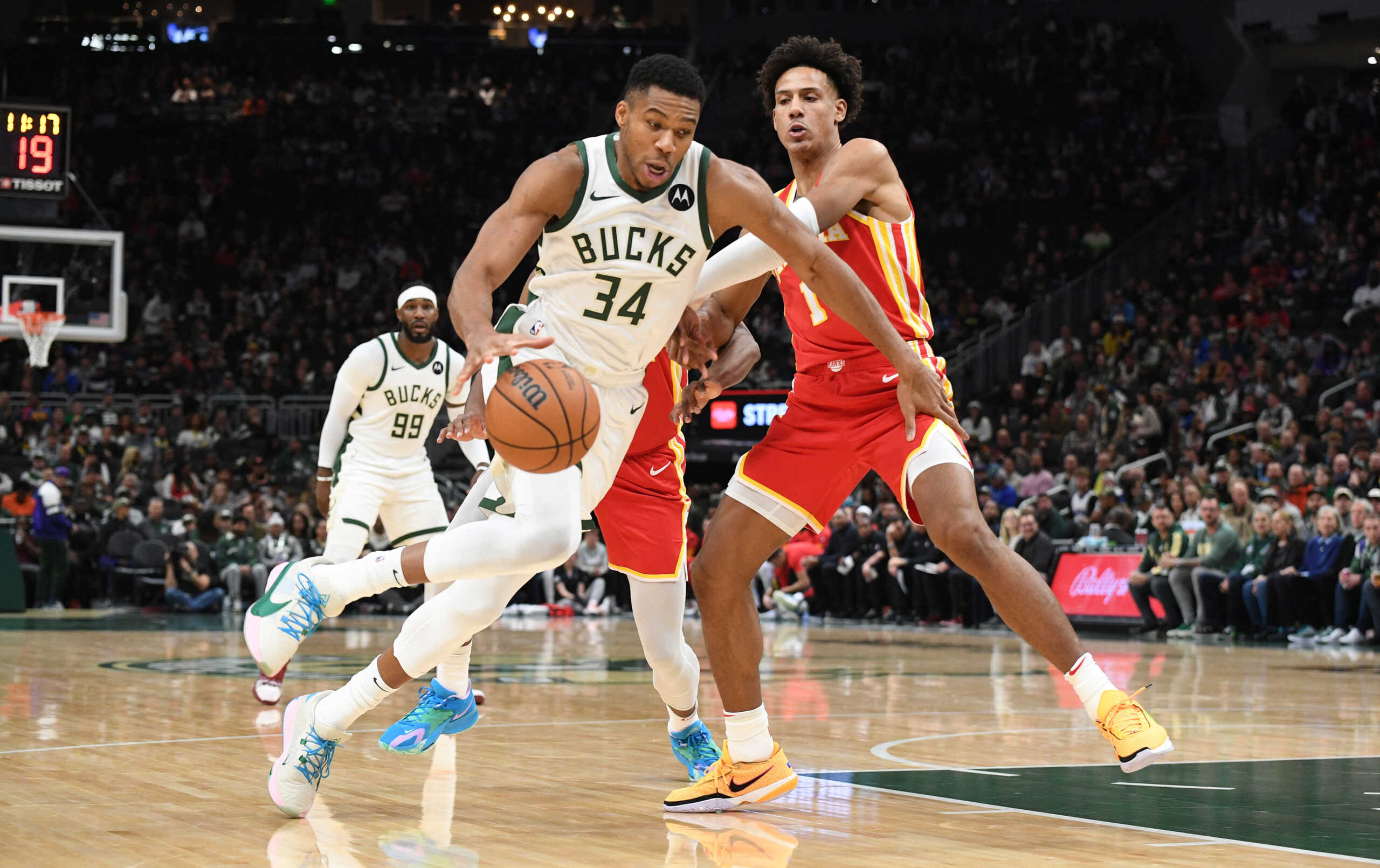 Oct 29, 2023; Milwaukee, Wisconsin, USA; Milwaukee Bucks forward Giannis Antetokounmpo (34) drives to the basket against Atlanta Hawks forward Jalen Johnson (1) in the first half at Fiserv Forum. Mandatory Credit: Michael McLoone-USA TODAY Sports