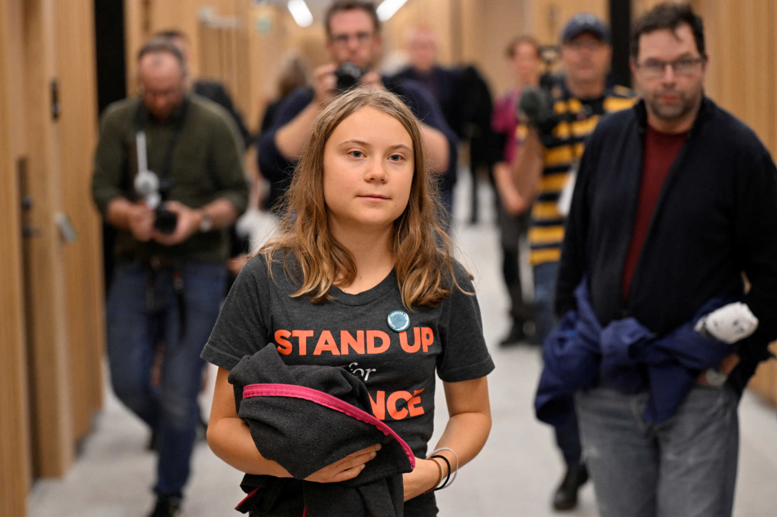 Swedish climate activist Greta Thunberg walks in Malmo district court, in Sweden October 11, 2023.  TT News Agency