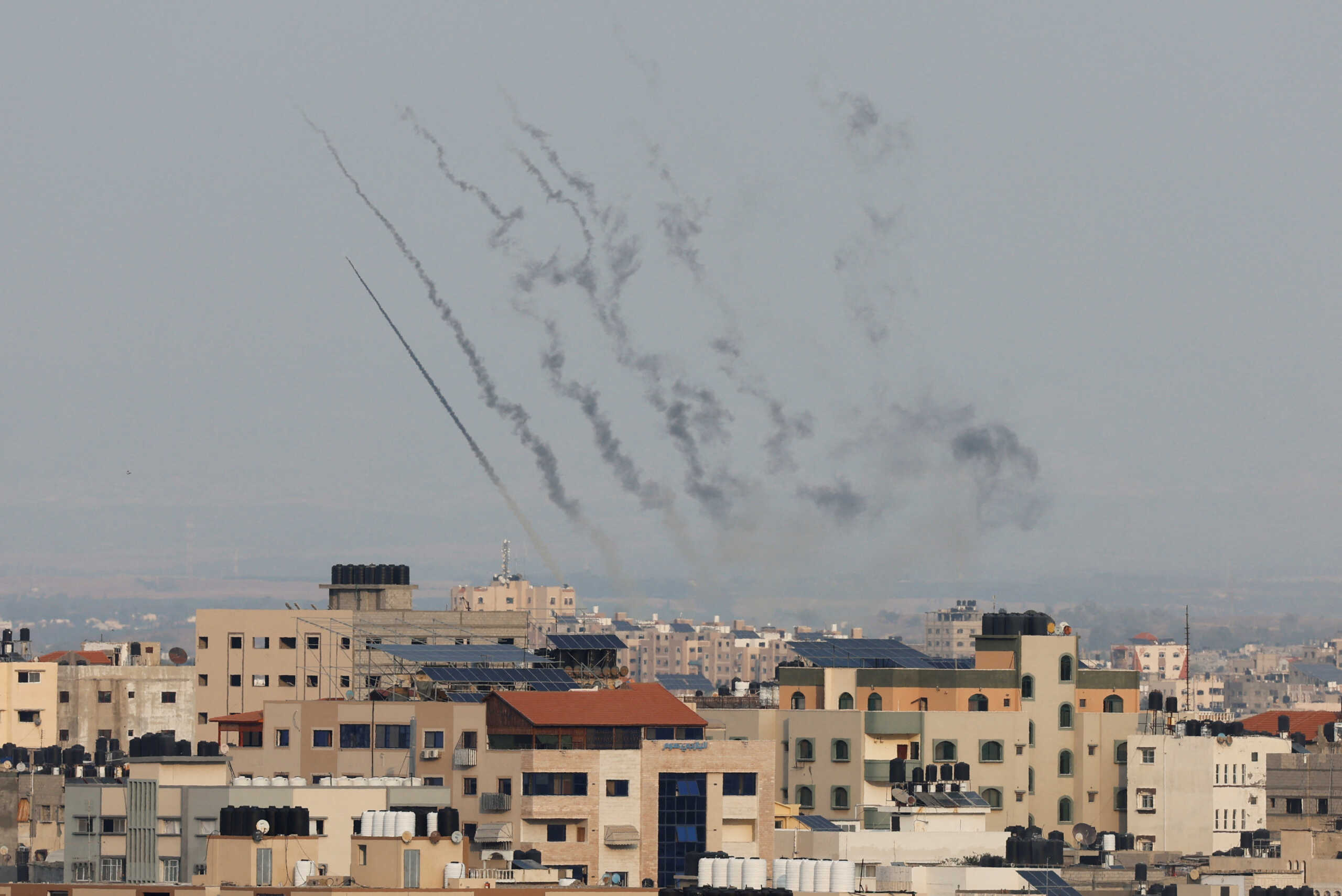 Rockets are fired from Gaza toward Israel, in Gaza, October 8, 2023. REUTERS