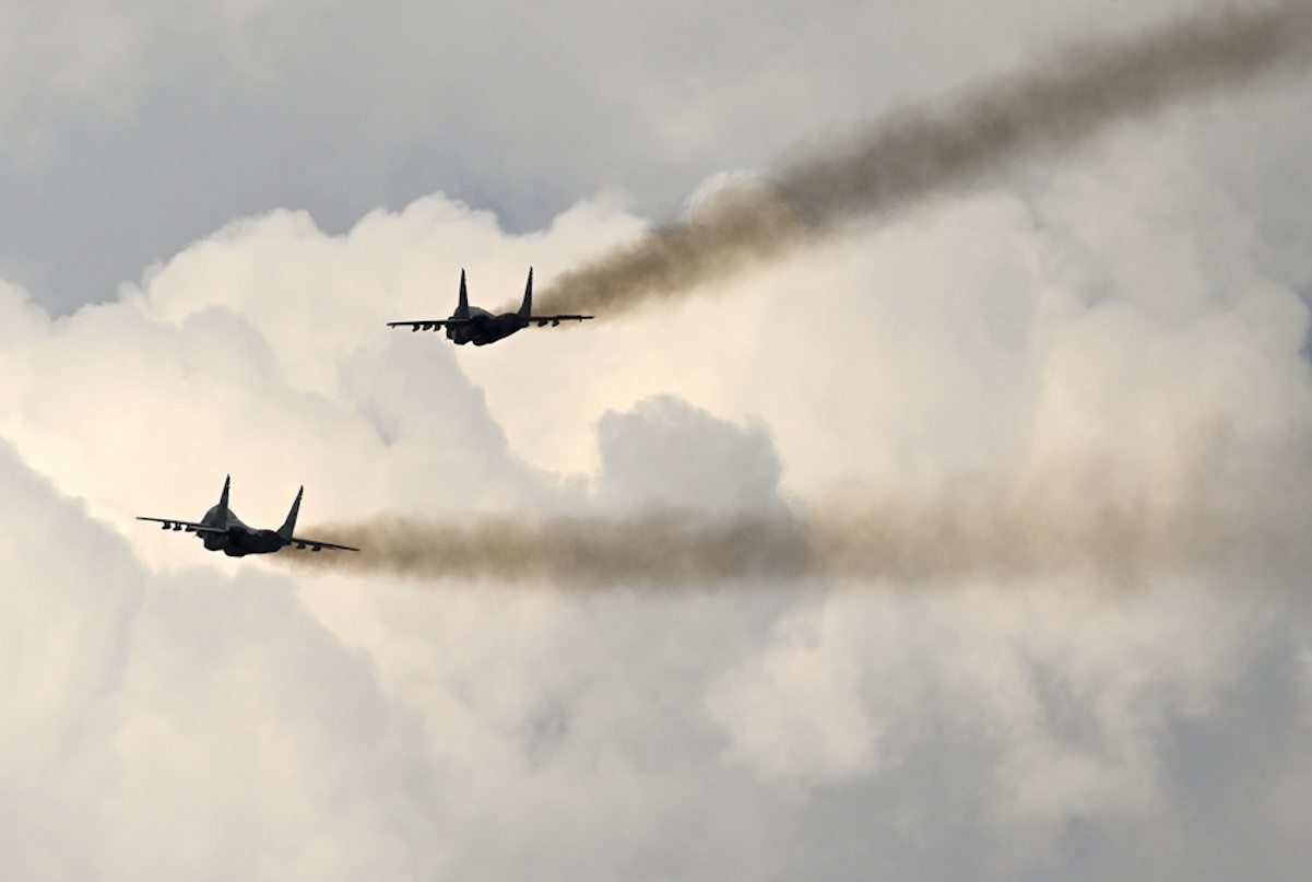 epa10864285 MIG-29 aircraft of the Serbian Air Force perform during the air show at the Stenkovec airport near Skopje, North Macedonia, 16 September 2023. More than 50 different aircraft participate in the air meeting to mark 100 years of Macedonian civil aviation.  EPA