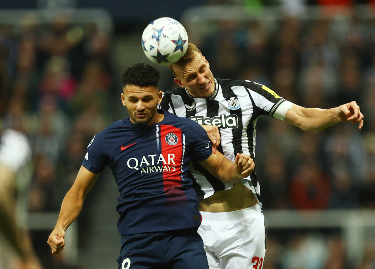 Soccer Football - Champions League - Group F - Newcastle United v Paris St Germain - St James' Park, Newcastle, Britain - October 4, 2023 Paris St Germain's Goncalo Ramos in action with Newcastle United's Dan Burn Action Images via Reuters