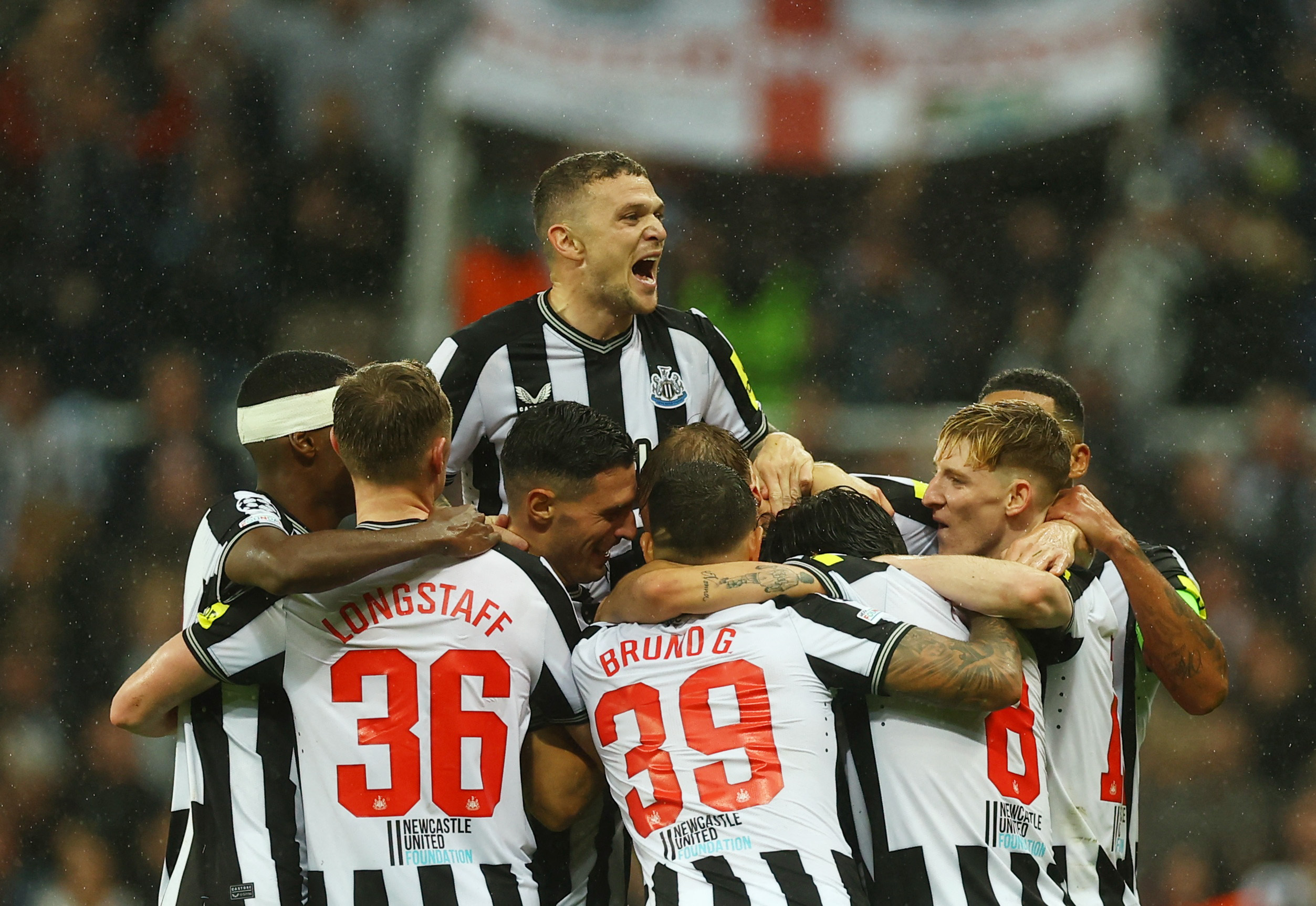 Soccer Football - Champions League - Group F - Newcastle United v Paris St Germain - St James' Park, Newcastle, Britain - October 4, 2023 Newcastle United's Dan Burn celebrates scoring their second goal with teammates Action Images via Reuters