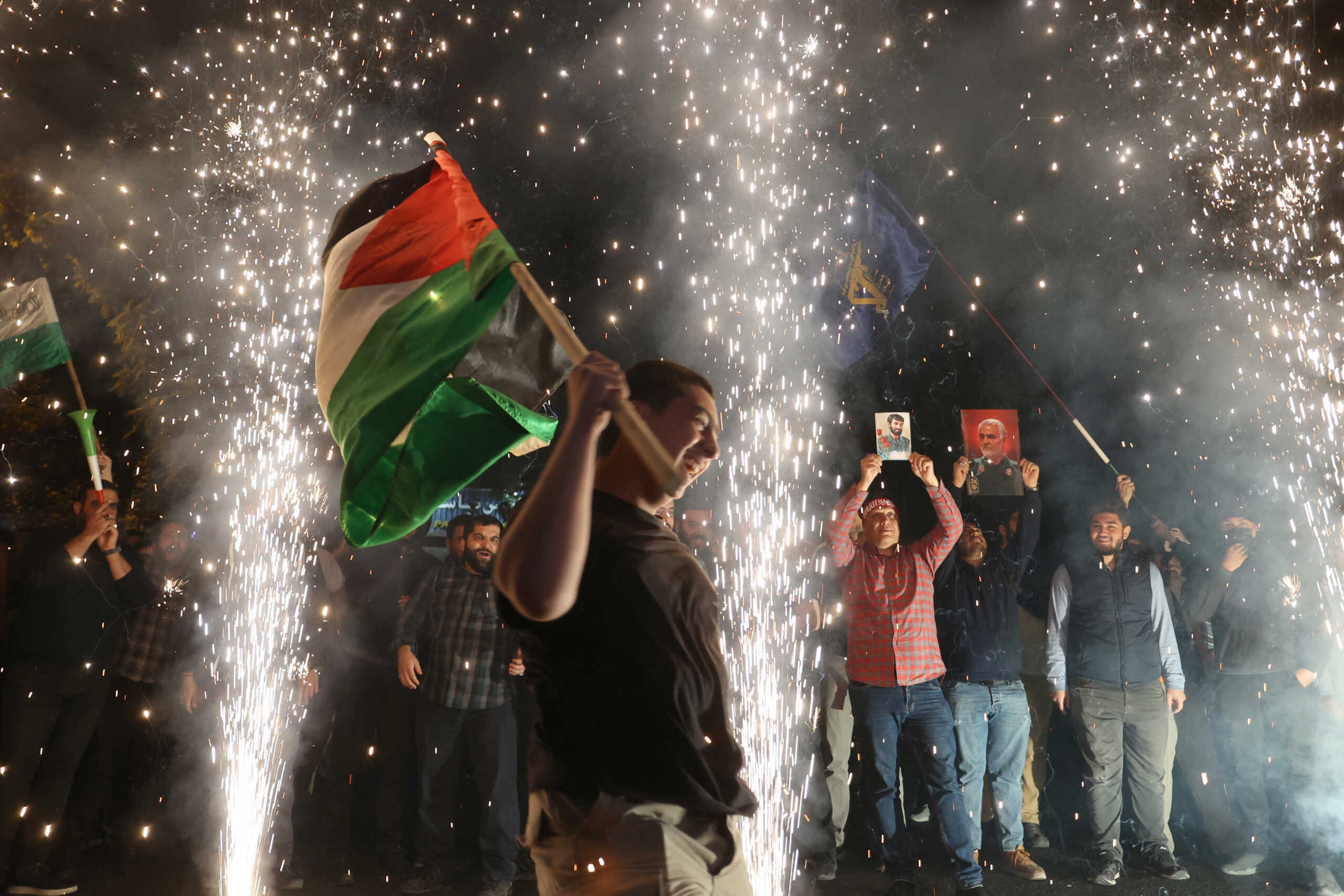 Iranian celebrate during a gathering in support of Palestinians, in Tehran, Iran, October 7, 2023. Majid Asgaripour