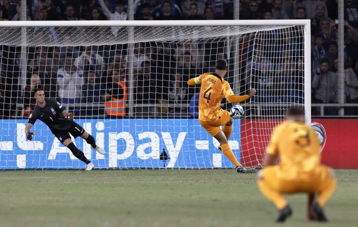 Soccer Football - Euro 2024 Qualifier - Group B - Greece v Netherlands - Agia Sophia Stadium, Athens, Greece - October 16, 2023 Netherlands' Virgil van Dijk scores their first goal from the penalty spot past Greece's Odisseas Vlachodimos REUTERS