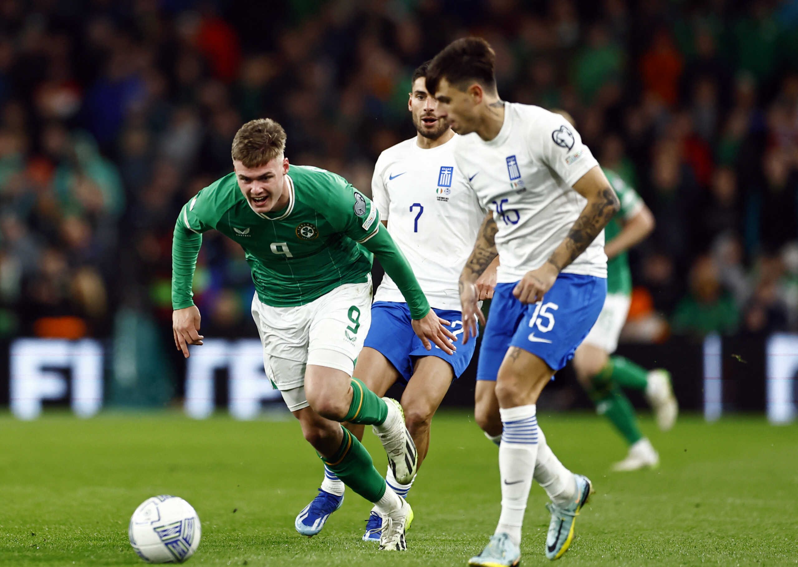 Soccer Football - Euro 2024 Qualifier - Group B - Republic of Ireland v Greece - Aviva Stadium, Dublin, Ireland - October 13, 2023 Republic of Ireland's Evan Ferguson in action with Greece's Georgios Masouras and Anastasios Chatzigiovanis REUTERS
