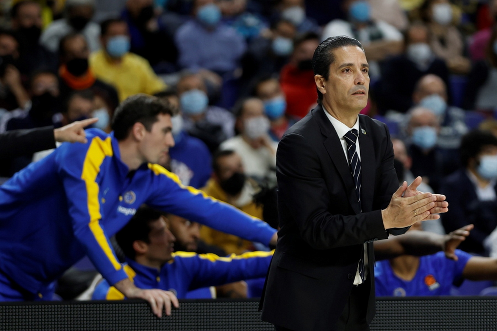 epa09617636 Tel Aviv's head coach Giannis Sfairopoulos (R) reacts during the Euroleague basketball game between Real Madrid and Maccabi Playtika Tel Aviv in Madrid, Spain, 02 December 2021.  EPA