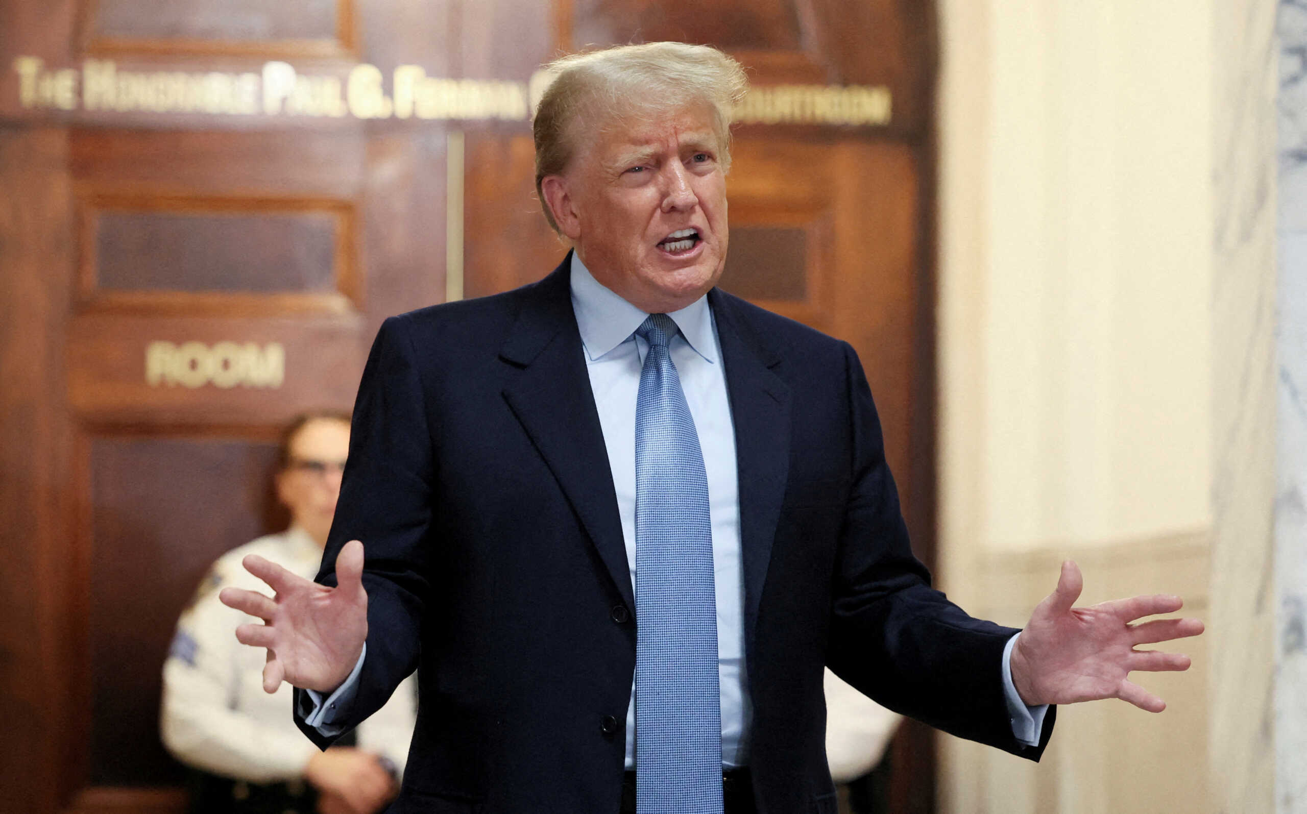 FILE PHOTO: Former U.S. President Donald Trump delivers remarks after exiting the courtroom as he attends his Manhattan courthouse trial in a civil fraud case in New York, U.S., October 18, 2023. REUTERS