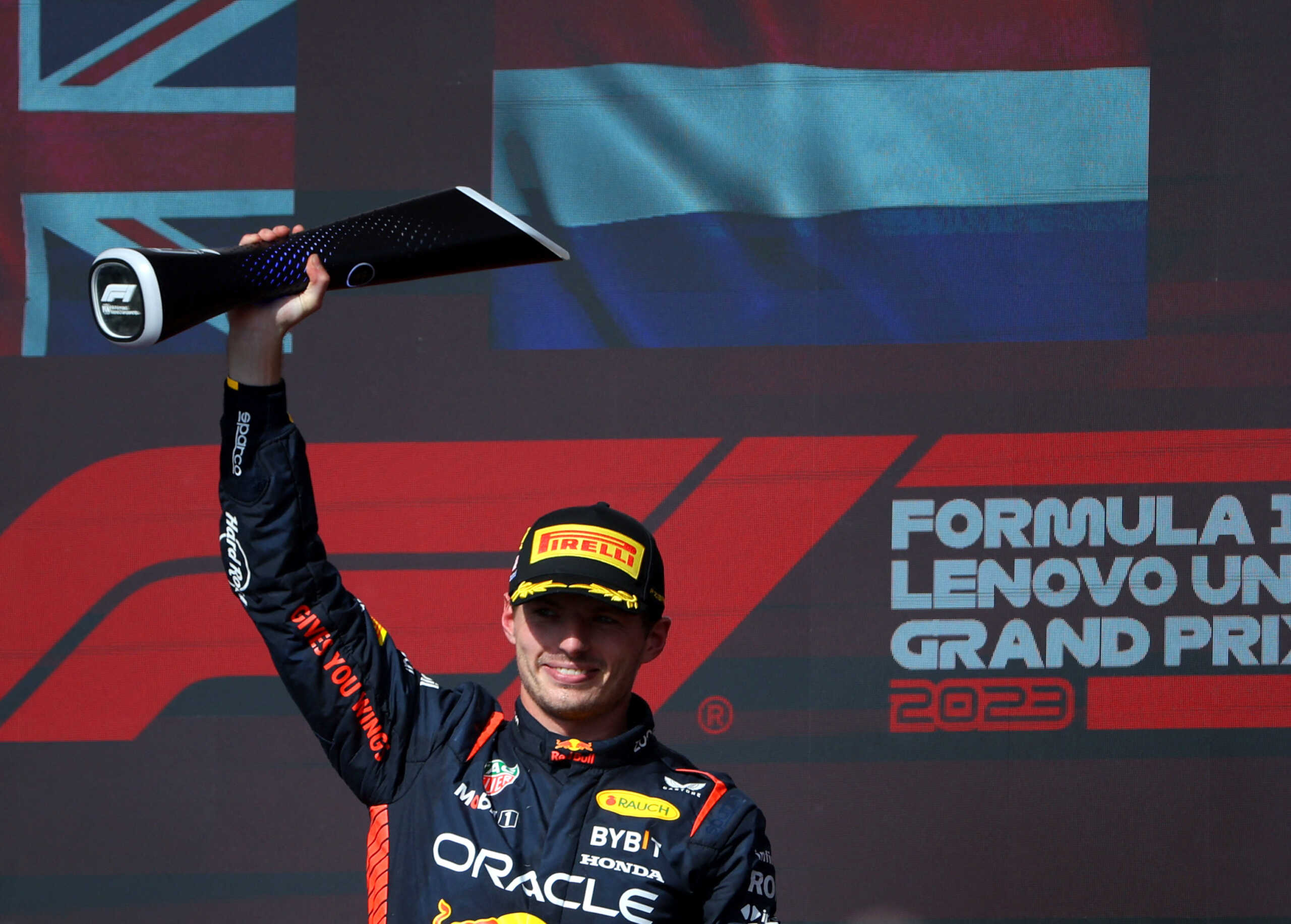 Formula One F1 - United States Grand Prix - Circuit of the Americas, Austin, Texas, U.S. - October 22, 2023 Red Bull's Max Verstappen celebrates on the podium with a trophy after winning the United States Grand Prix REUTERS