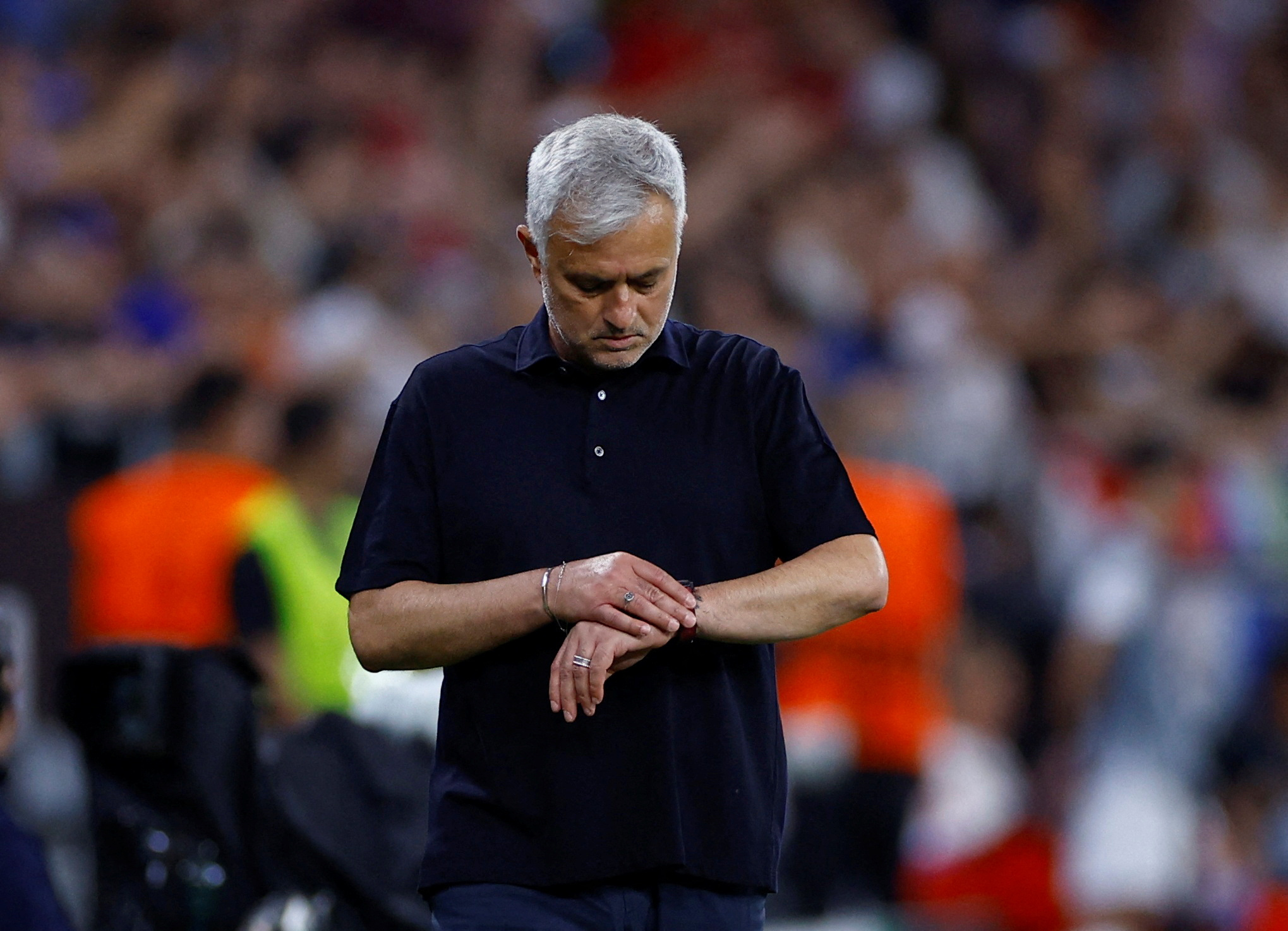 FILE PHOTO: Soccer Football - Europa League - Final - Sevilla v AS Roma - Puskas Arena, Budapest, Hungary - May 31, 2023  AS Roma coach Jose Mourinho checks his watch REUTERS