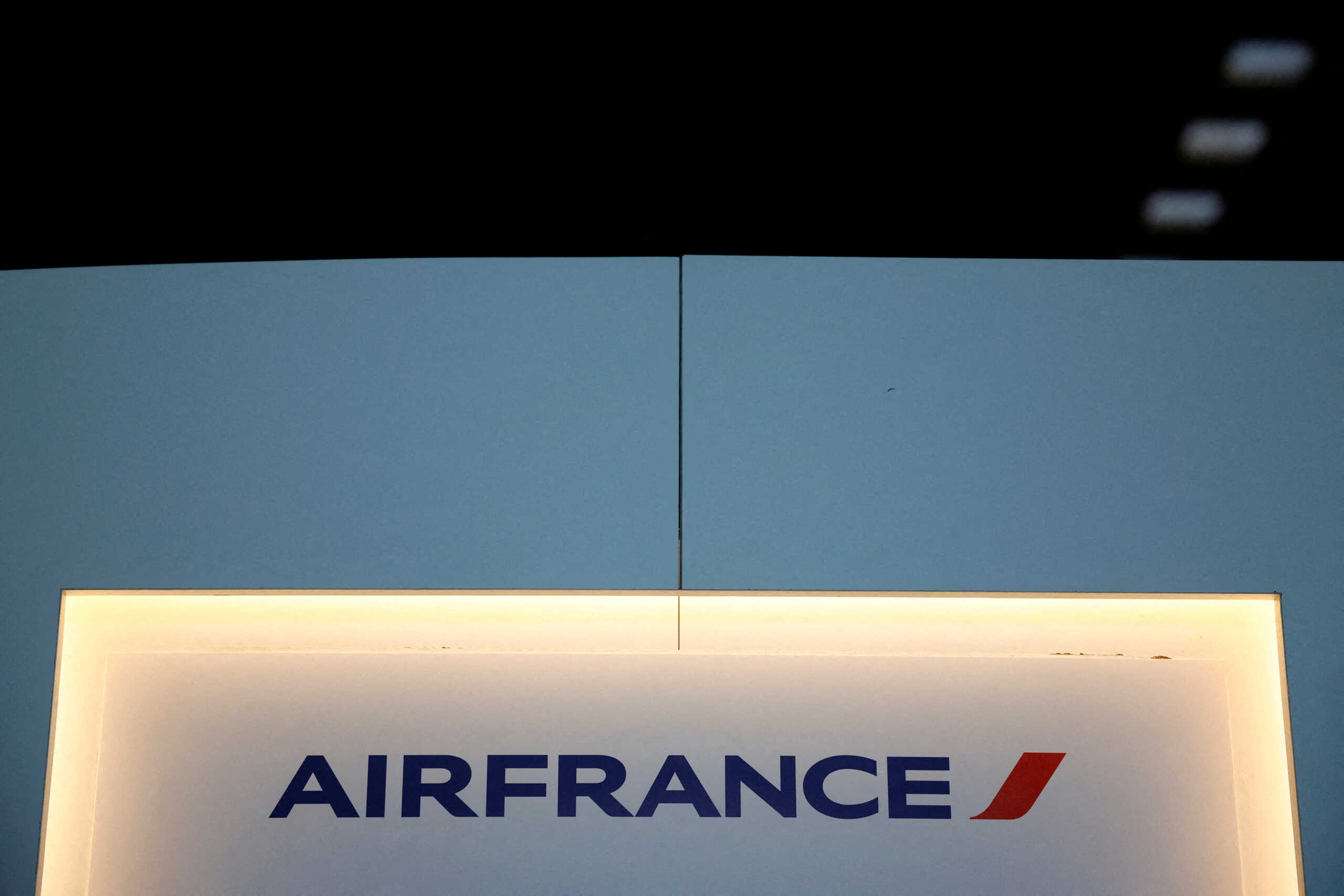 FILE PHOTO: A logo of airline company Air France is seen in the Terminal 2E at the Paris-Charles de Gaulle airport in Roissy near Paris, France, July 1, 2022. REUTERS