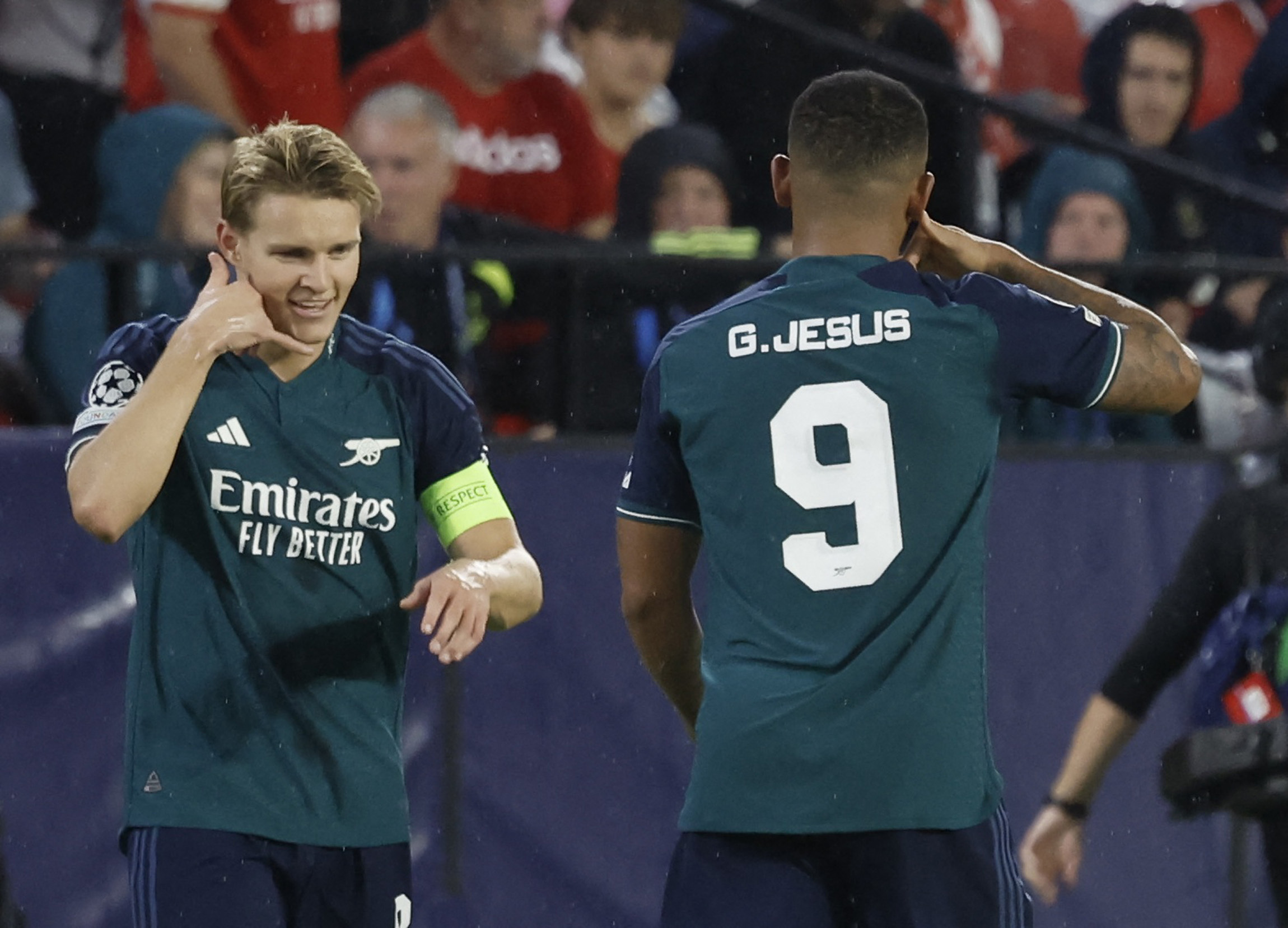Soccer Football - Champions League - Group B - Sevilla v Arsenal - Ramon Sanchez Pizjuan, Seville, Spain - October 24, 2023 Arsenal's Gabriel Jesus celebrates scoring their second goal with Martin Odegaard REUTERS