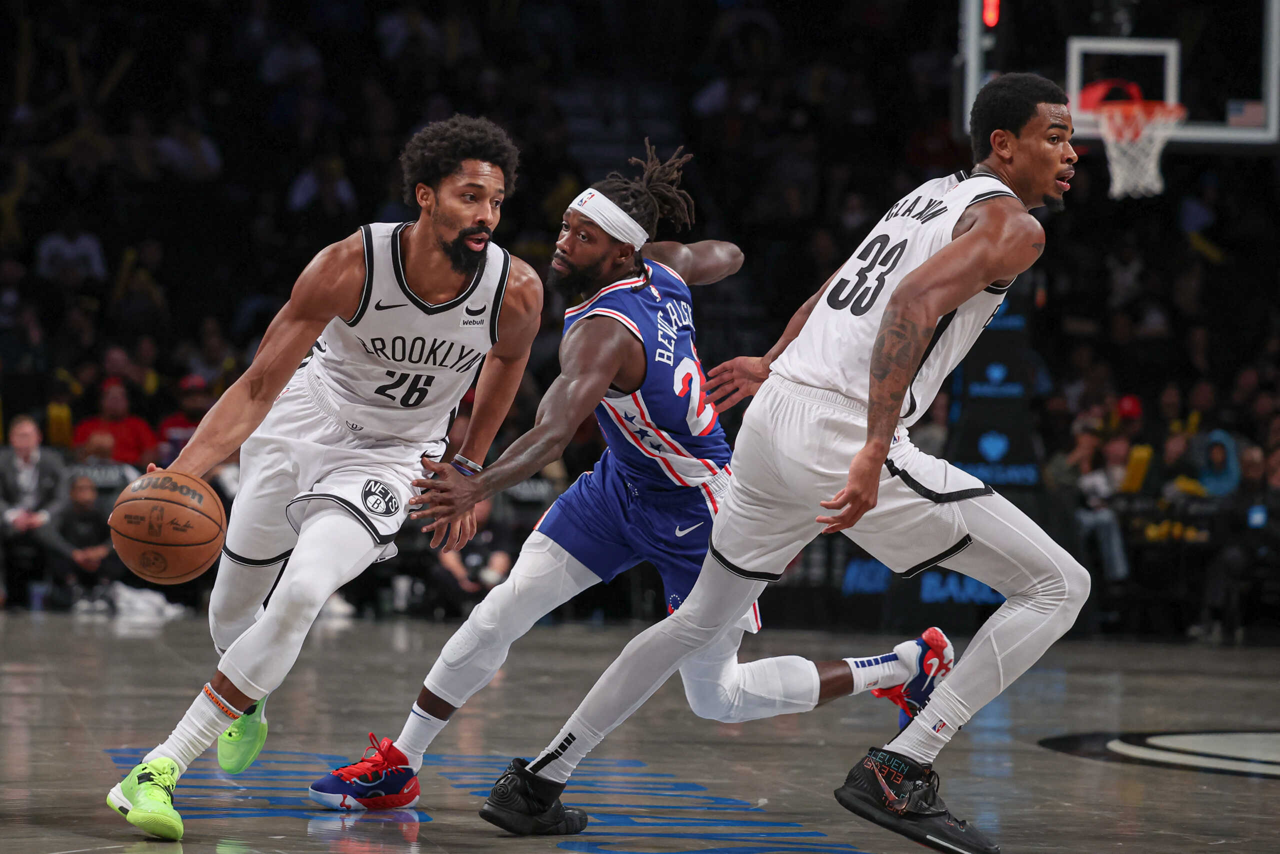 Oct 16, 2023; Brooklyn, New York, USA; Brooklyn Nets forward Dorian Finney-Smith (28) dribbles as Philadelphia 76ers guard Patrick Beverley (22) defends during the second half in front of center Nic Claxton (33) at Barclays Center. Mandatory Credit: Vincent Carchietta-USA TODAY Sports