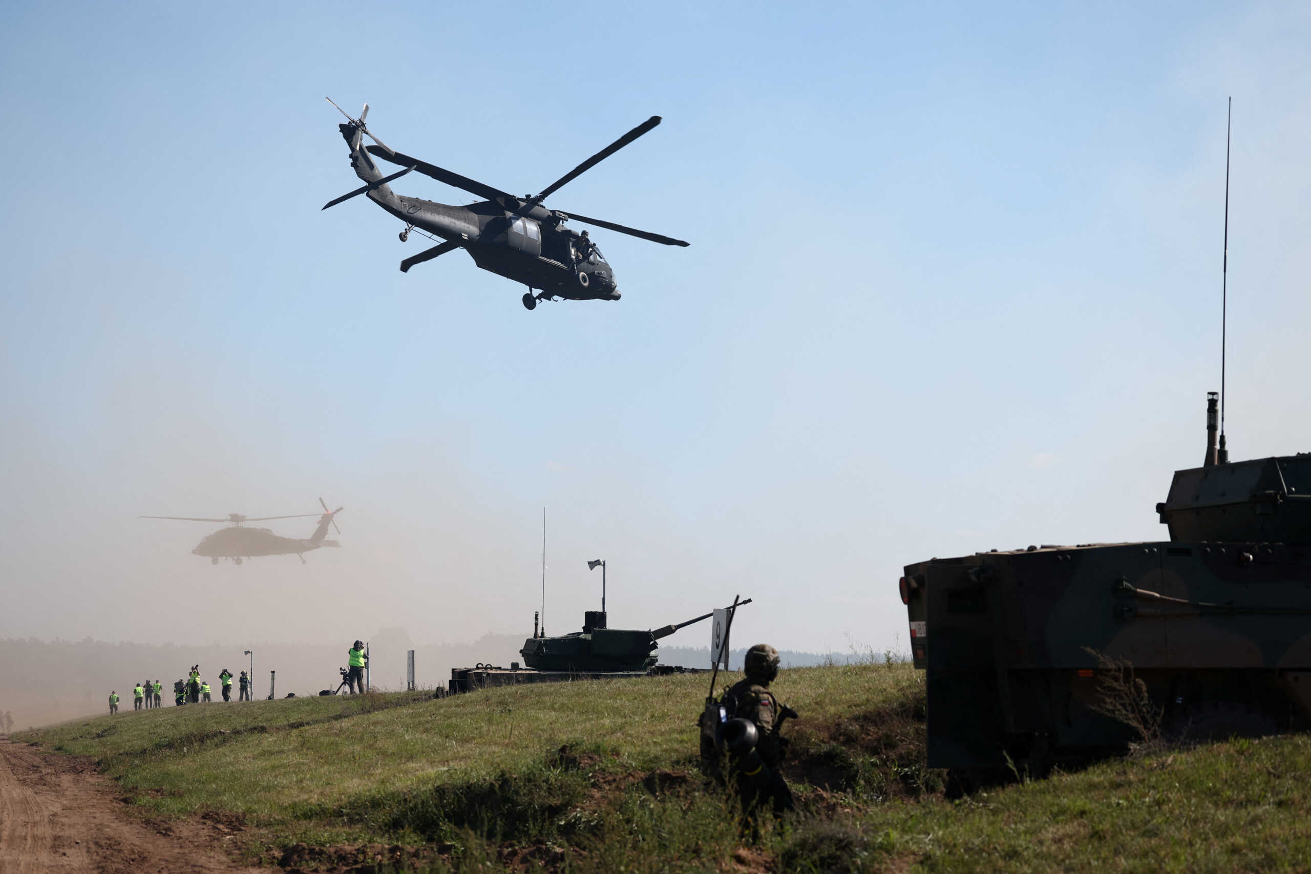 Black Hawk helicopter flies above Polish soldiers during trial drills prior to annual artillery show ‘Autumn Fire 23’ at a military range in Bemowo Piskie near Orzysz, Poland, September 16, 2023. REUTERS