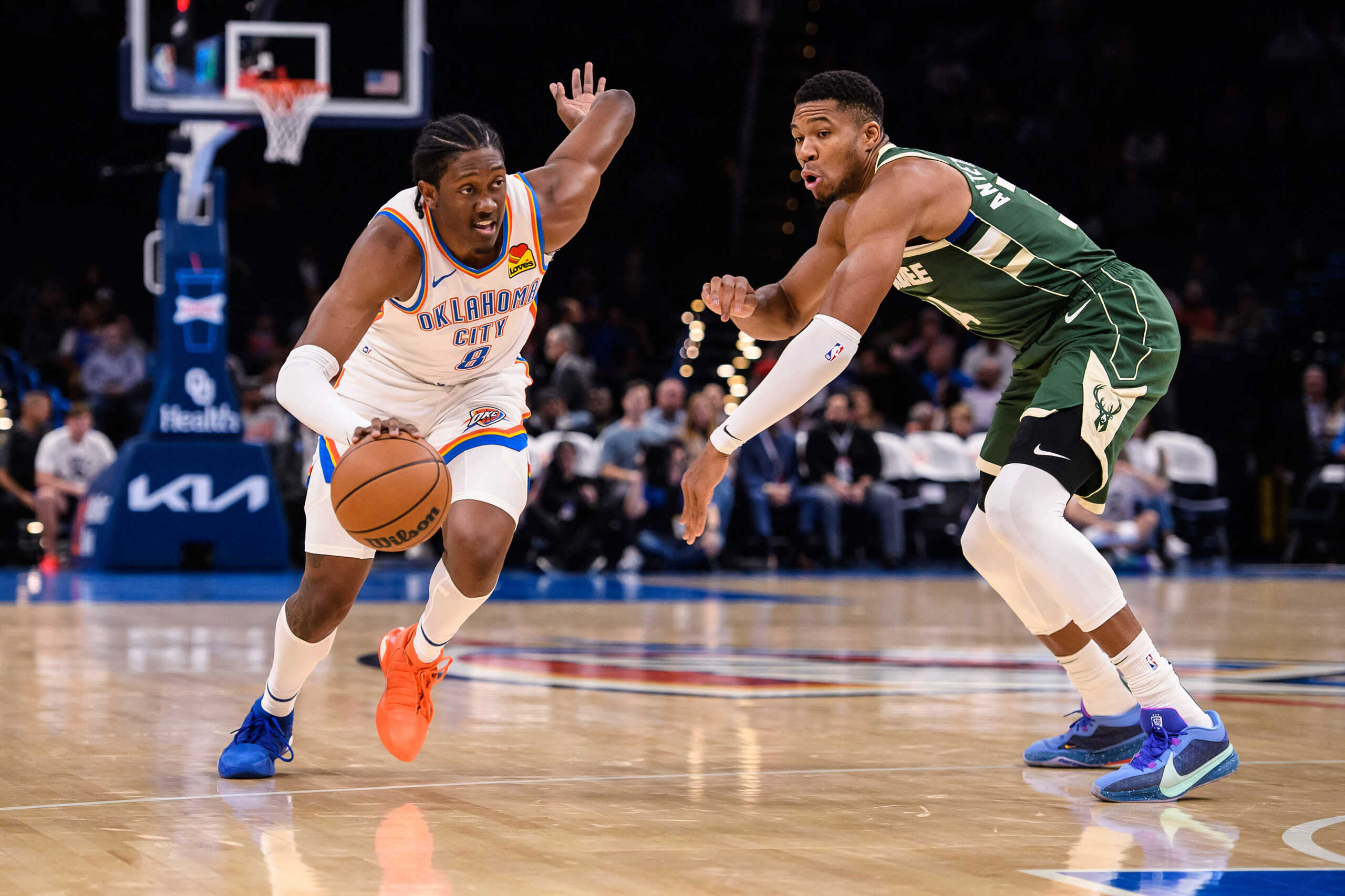 Oct 17, 2023; Oklahoma City, Oklahoma, USA; Oklahoma City Thunder forward Jalen Williams (8) dribbles while defended by Milwaukee Bucks forward Thanasis Antetokounmpo (43) during the first half at Paycom Center. Mandatory Credit: Rob Ferguson-USA TODAY Sports