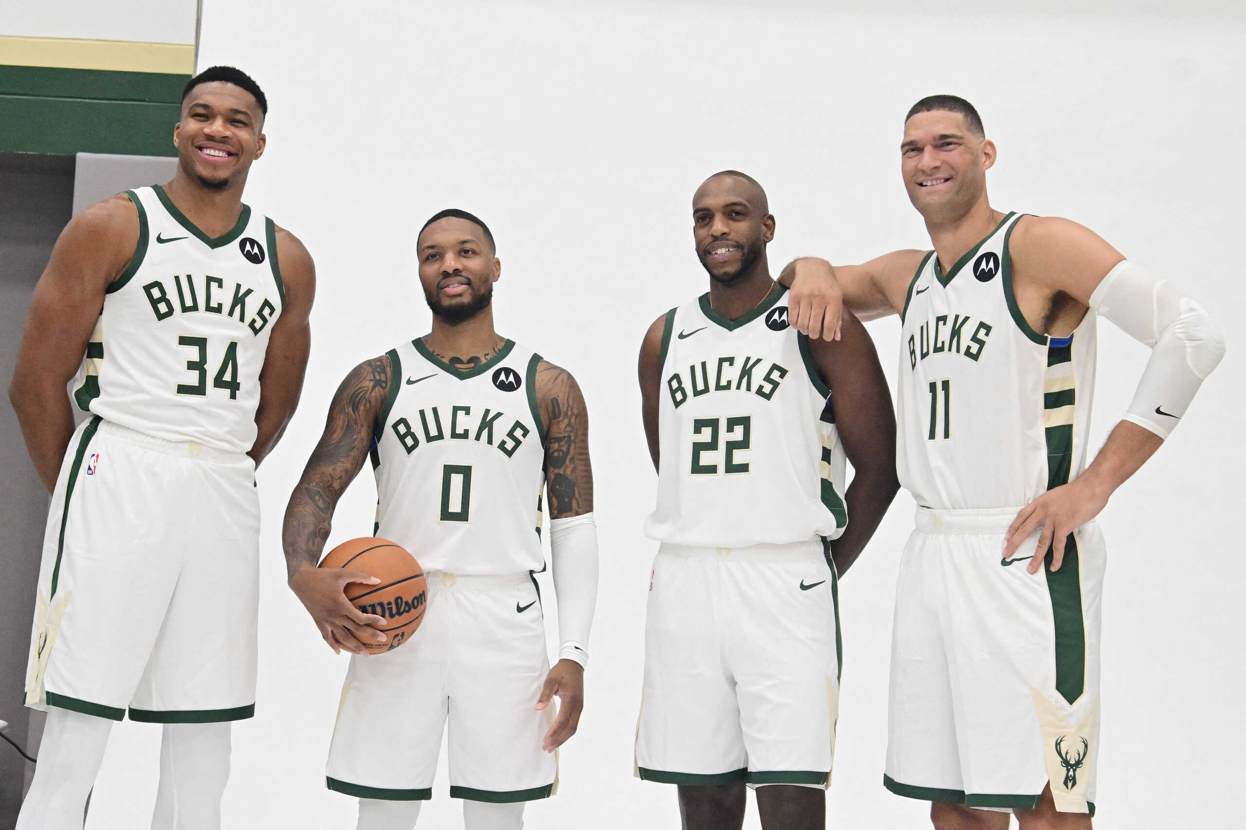 Oct 2, 2023; Milwaukee, WI, USA; Milwaukee Bucks forward Giannis Antetokounmpo (34), guard Damian Lillard (0), forward Khris Middleton (22), and center Brook Lopez (11) pose for a picture during media day in Milwaukee.  Mandatory Credit: Benny Sieu-USA TODAY Sports