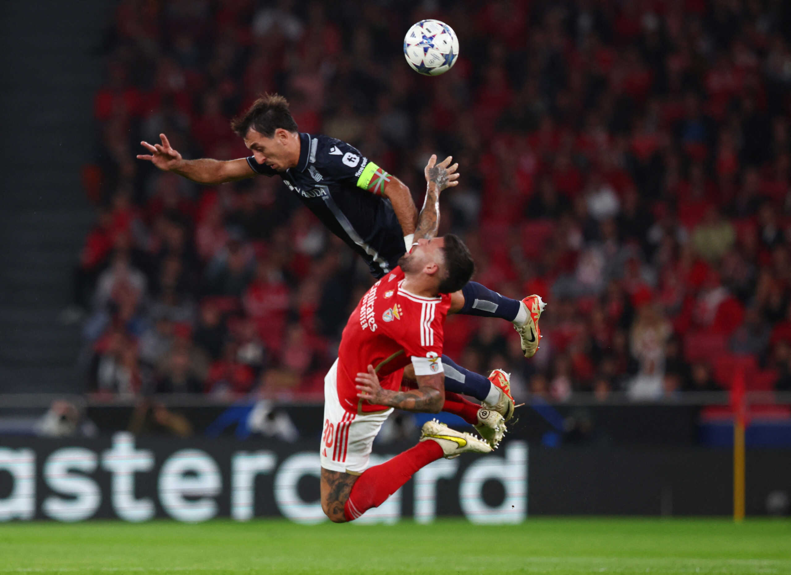 Soccer Football - Champions League - Group D - Benfica v Real Sociedad - Estadio da Luz, Lisbon, Portugal - October 24, 2023 Real Sociedad's Mikel Oyarzabal in action with Benfica's Nicolas Otamendi REUTERS
