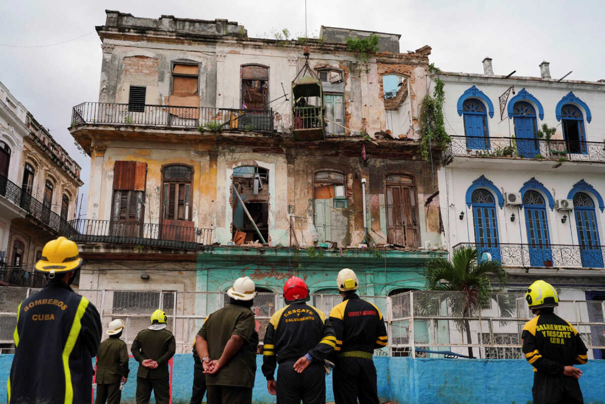 Emergency services work on the site where a residential building collapsed in Havana, Cuba, October 4, 2023. REUTERS