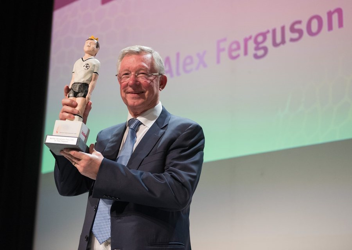 epa05596962 Former Manchester United manager Sir Alex Fergusson smiles with his Walther Bensemann prize in Nuremberg, Germany, 21 October 2016.  EPA