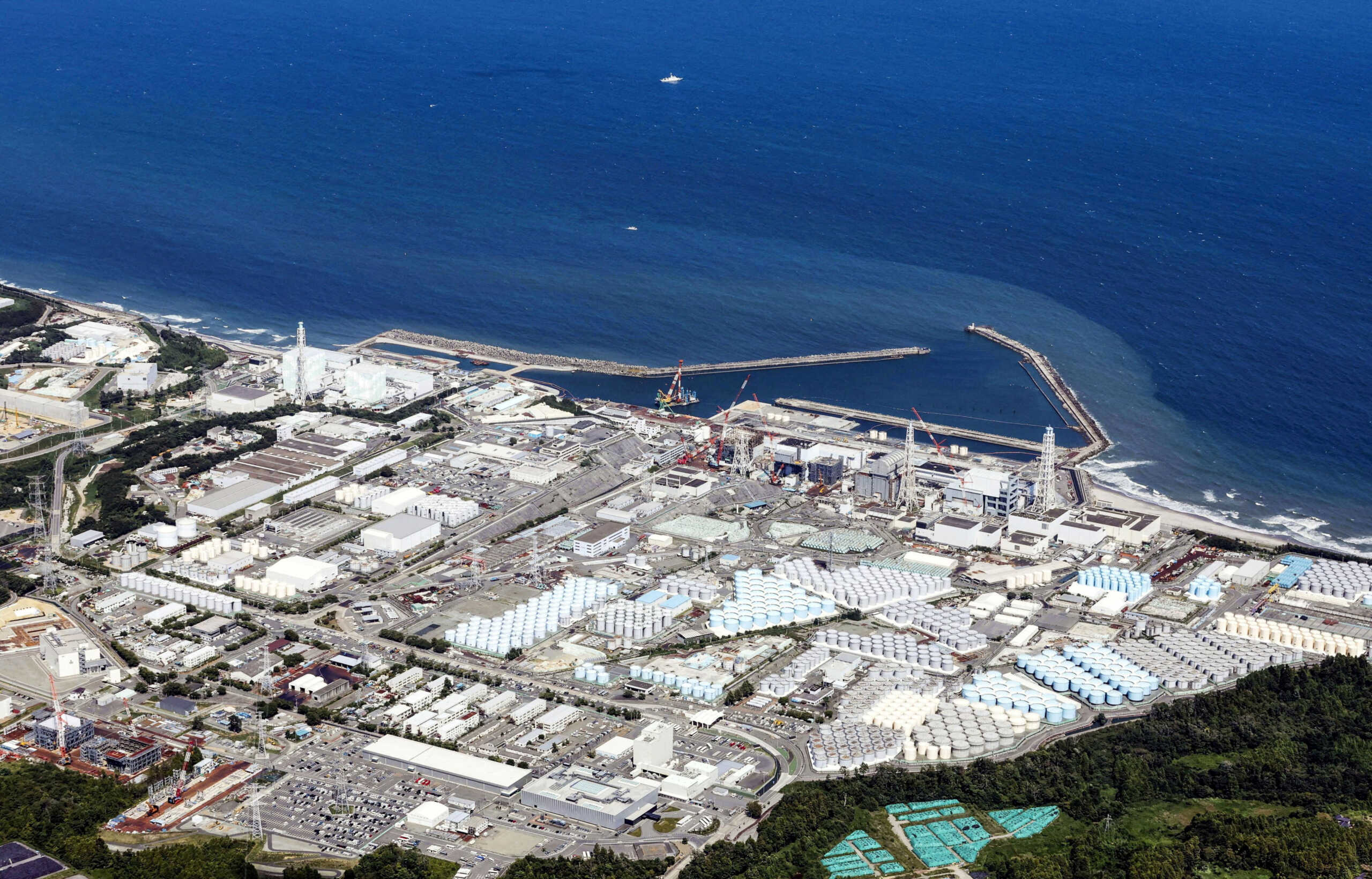FILE PHOTO: An aerial view shows the Fukushima Daiichi nuclear power plant, which started releasing treated radioactive water into the Pacific Ocean, in Okuma town, Fukushima prefecture, Japan August 24, 2023, in this photo taken by Kyodo. Kyodo