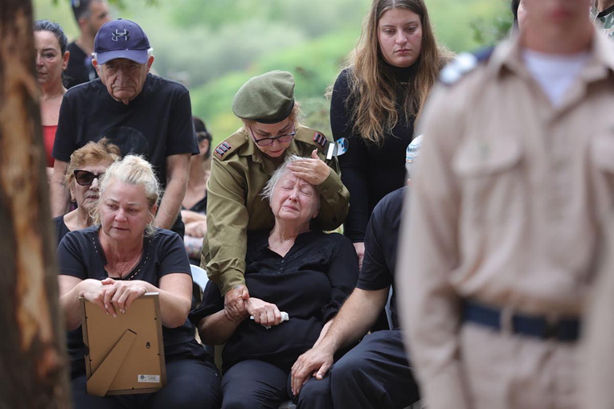 epa10909058 Family members mourn during the funeral of Israeli soldier Yuval Ben Yaakov, who died during fighting with Hamas militants on the border with the Gaza Strip, in the kibbutz of Kfar Menahem, southern Israel, 09 October 2023. The Israeli army announced on 09 October, it carried out over 500 strikes on targets across the Gaza Strip overnight. Palestinian officials said almost 500 people were killed, including 91 children, and over 2,700 were injured after Israel launched retaliatory raids and air strikes in the Palestinian enclave. An unprecedented attack on southern Israel on 07 October claimed by the Islamist movement Hamas killed more than 700 Israelis and left over 2,150 injured, the Israeli army said.  EPA
