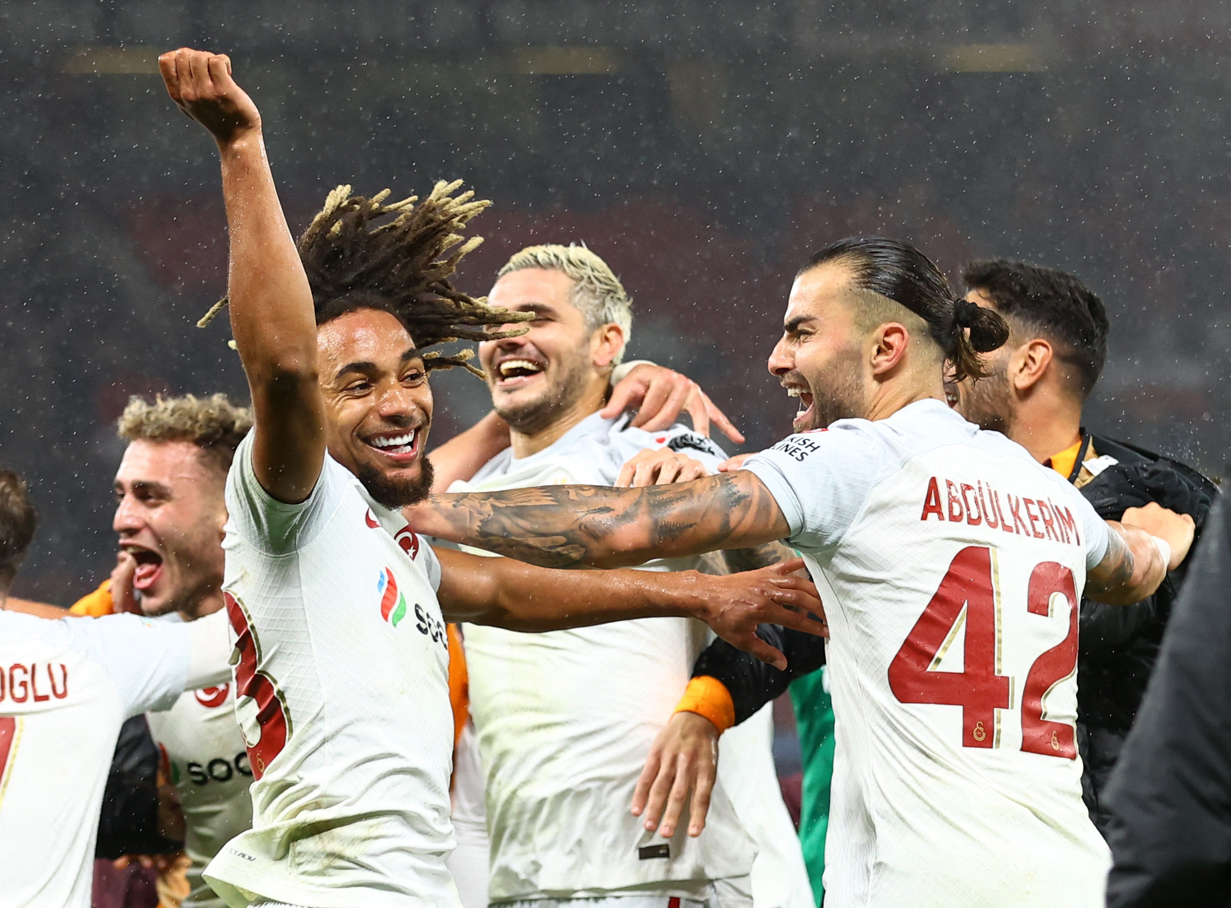 Soccer Football - Champions League - Group A - Manchester United v Galatasaray - Old Trafford, Manchester, Britain - October 3, 2023 Galatasaray's Sacha Boey, Mauro Icardi and Abdulkerim Bardakci celebrate after the match REUTERS