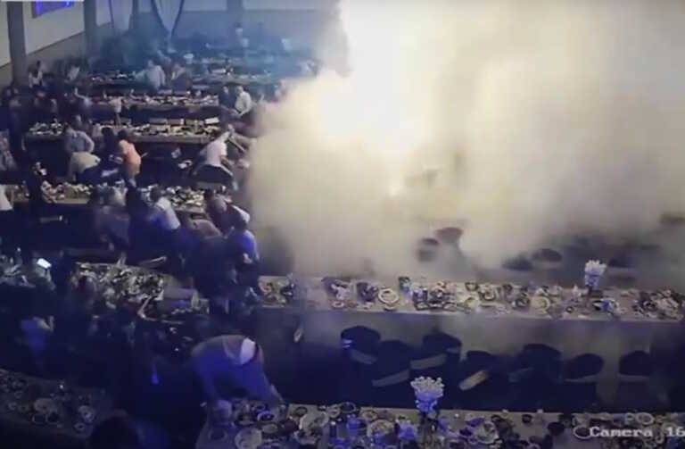New video from bloody wedding in Iraq - Burning roof falls and flattens guests