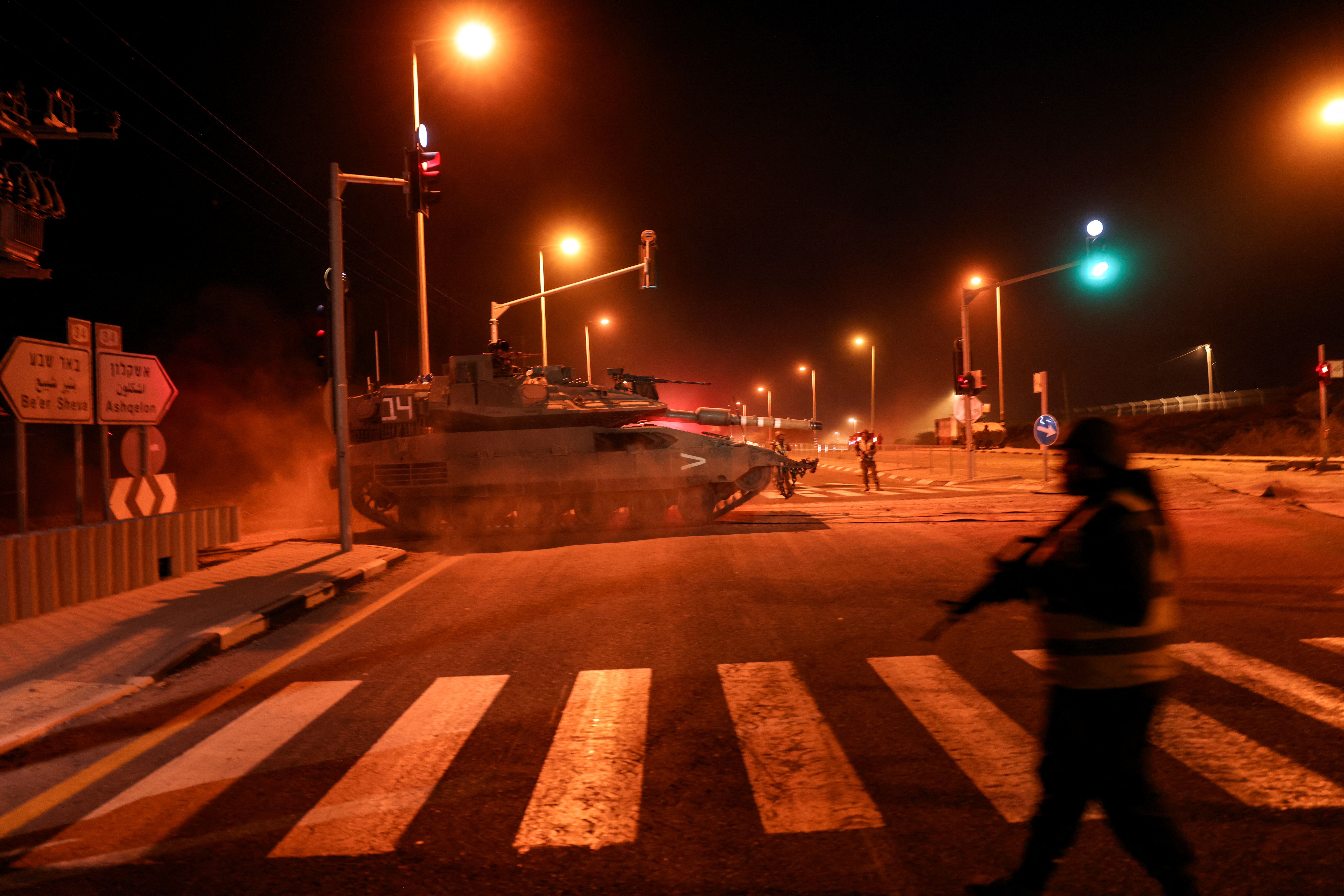 An Israeli soldier maneuvers a tank on a road near Israel's border with the Gaza Strip, in southern Israel, October 12, 2023. REUTERS