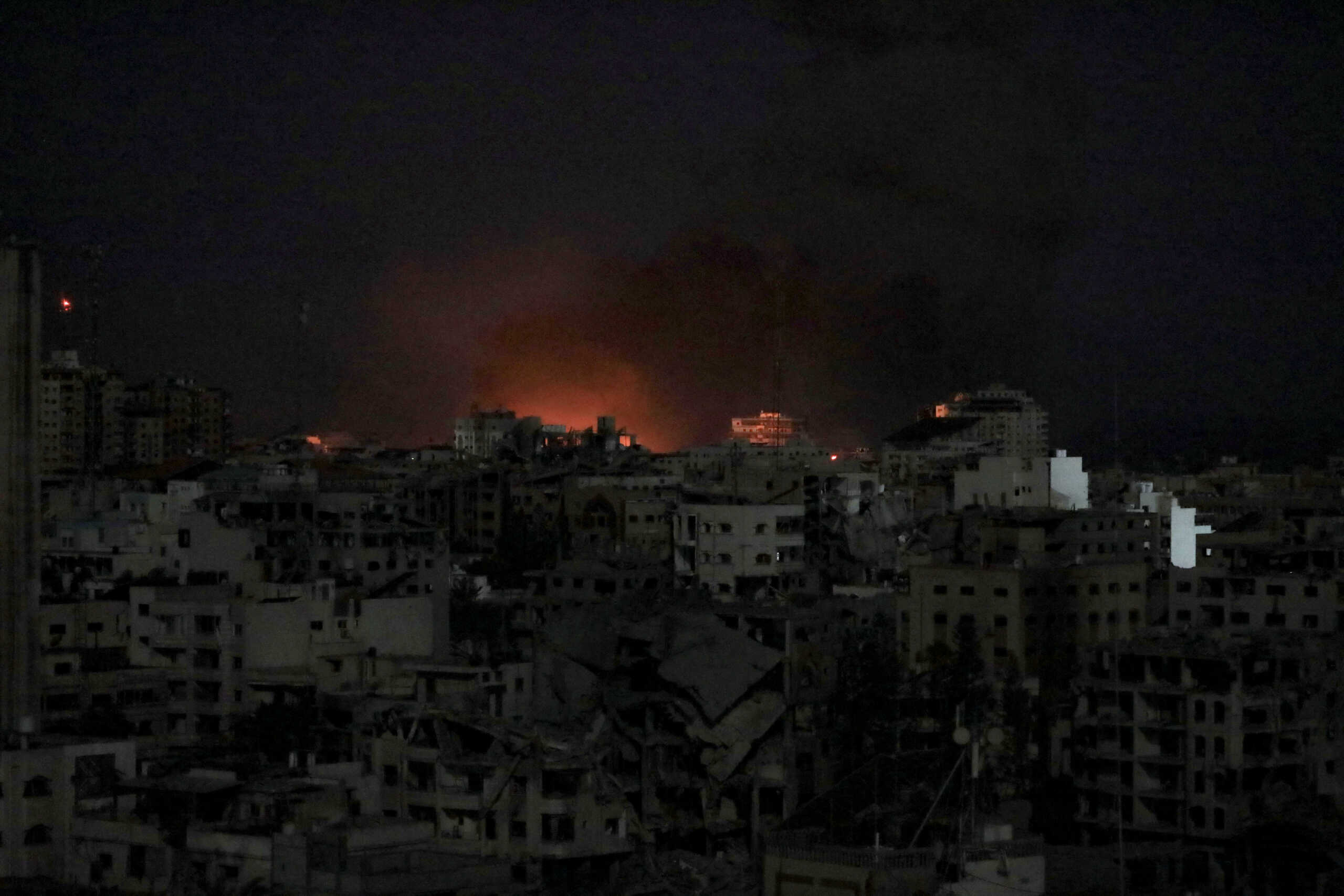 Flames rise during an Israeli air strike on west Gaza, October 30, 2023. REUTERS