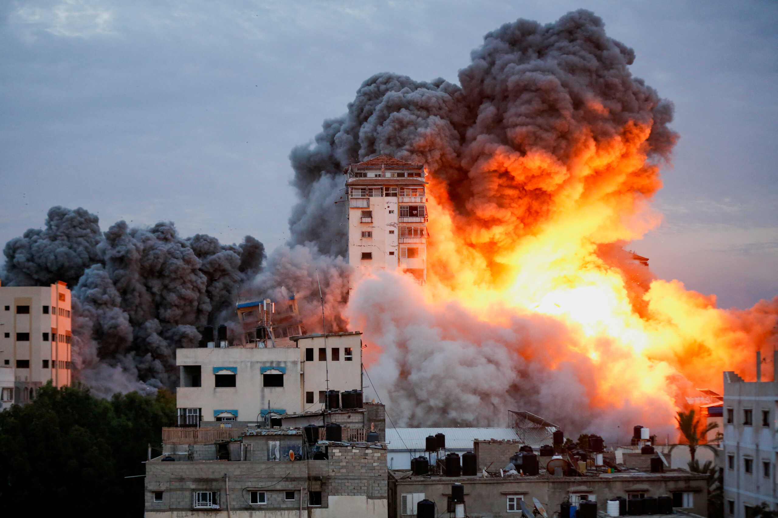 Smoke and flames billow after Israeli forces struck a high-rise tower in Gaza City, October 7, 2023. REUTERS