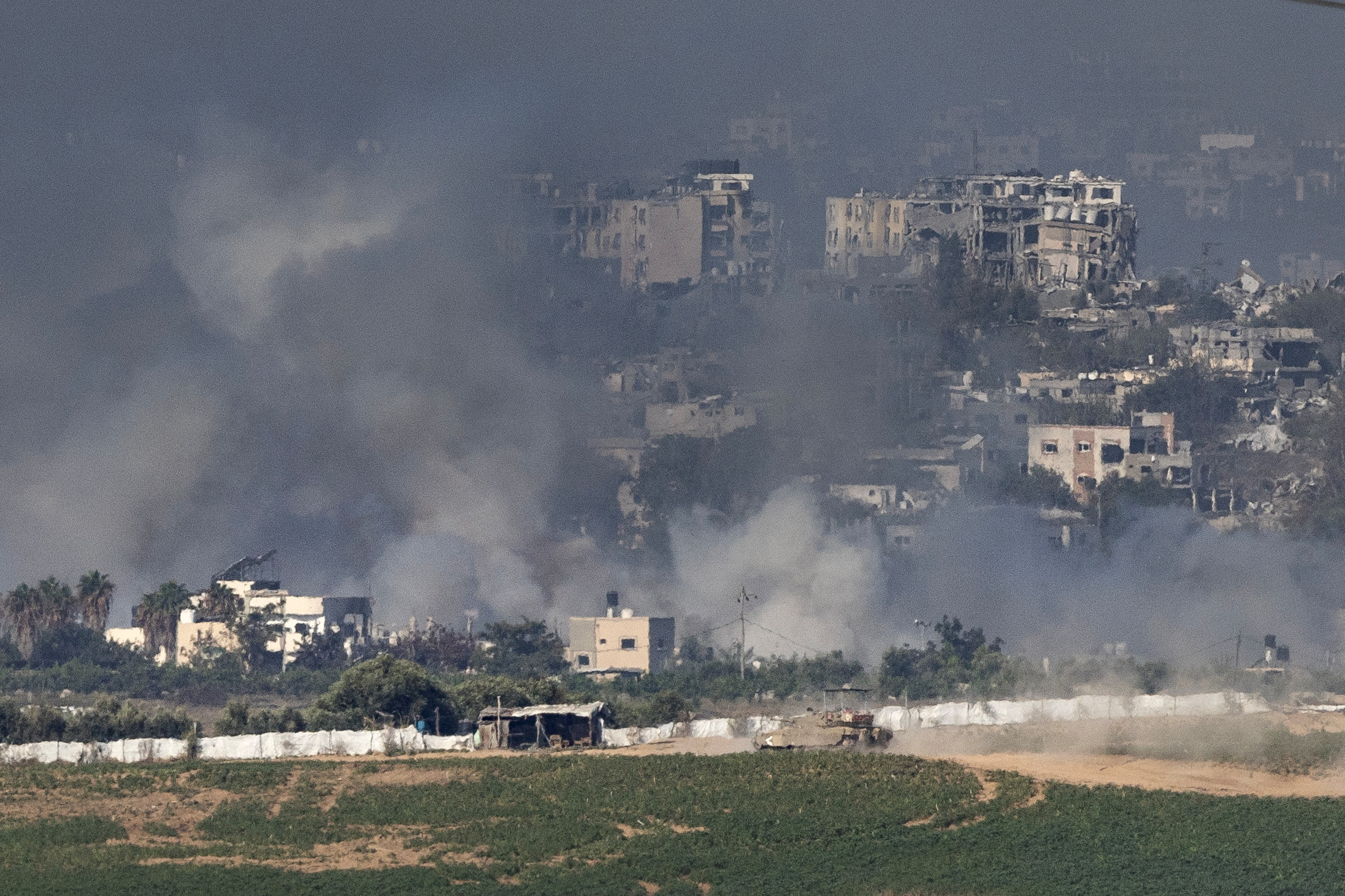 An Israeli tank manoeuvres inside the Gaza Strip, as seen from Israel, October 31, 2023. REUTERS