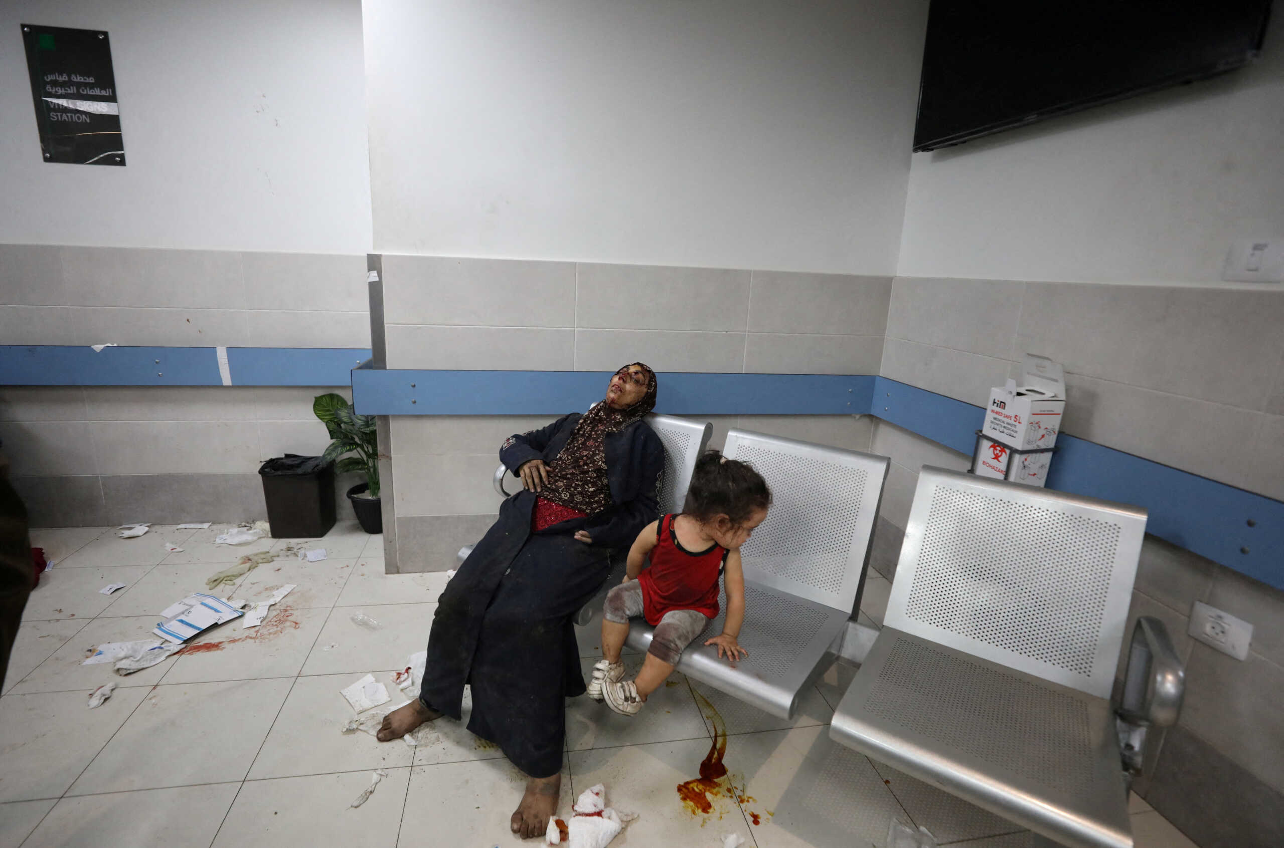 SENSITIVE MATERIAL. THIS IMAGE MAY OFFEND OR DISTURB    People sit at Shifa Hospital after an Israeli air strike hit the nearby Al-Ahli Hospital, according to Gaza Health Ministry, in Gaza City, Gaza Strip, October 17, 2023. REUTERS