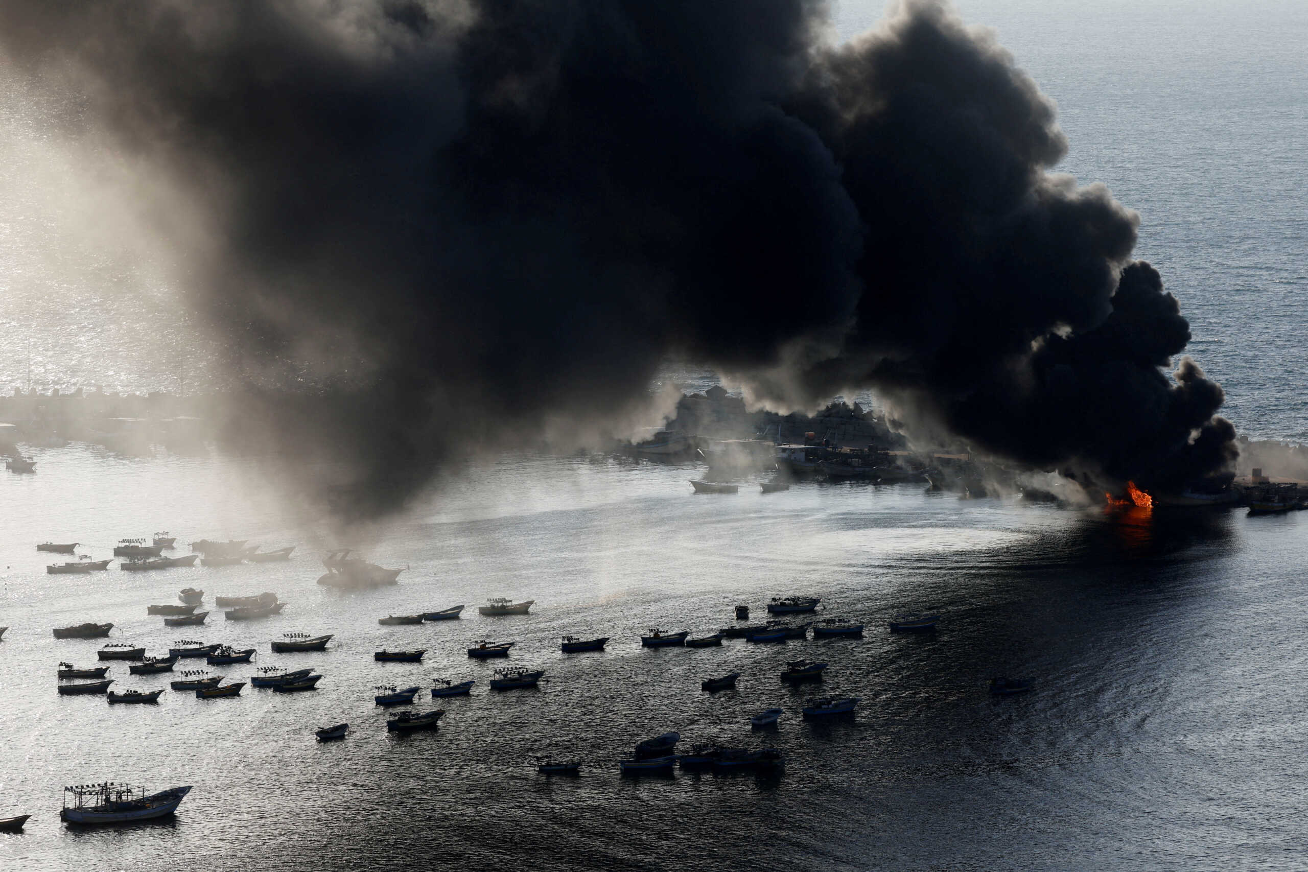 Smoke rises after Israeli strikes on the seaport of Gaza City, in Gaza, October 10, 2023. REUTERS
