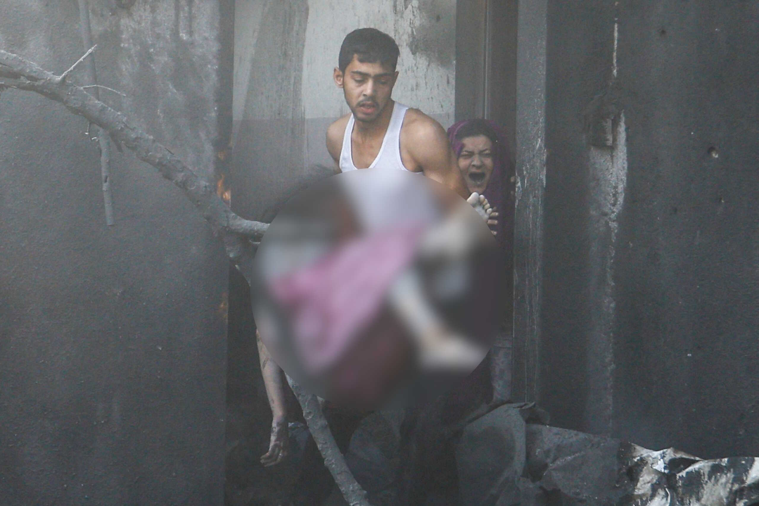 SENSITIVE MATERIAL. THIS IMAGE MAY OFFEND OR DISTURB    A man carries a wounded Palestinian girl as a woman reacts at the site of Israeli strikes on a house, in Khan Younis in the southern Gaza Strip  October 11, 2023. REUTERS
