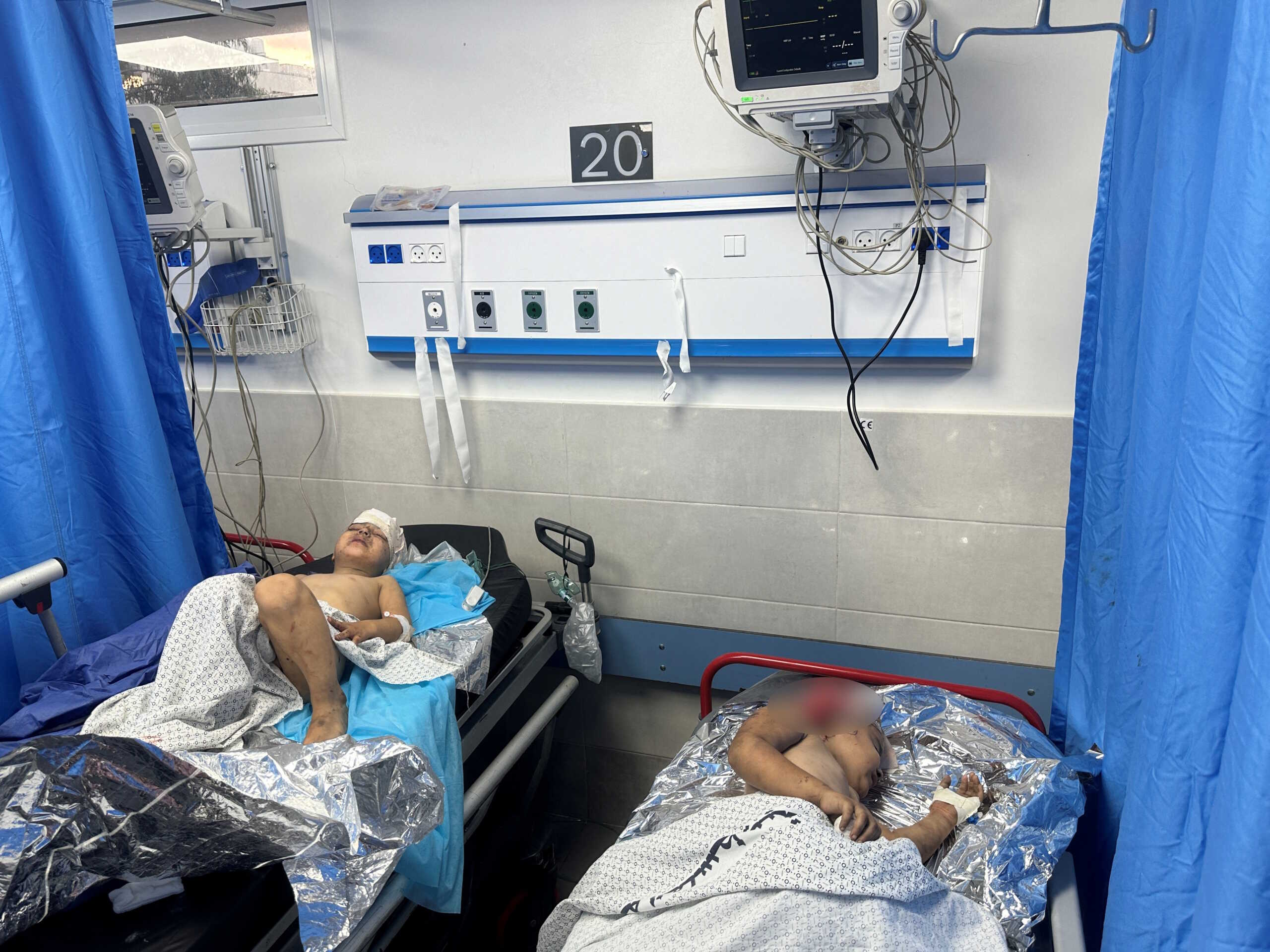 Palestinian children wounded in Israeli strikes receive treatment in a hospital in Gaza city, October 11, 2023. REUTERS