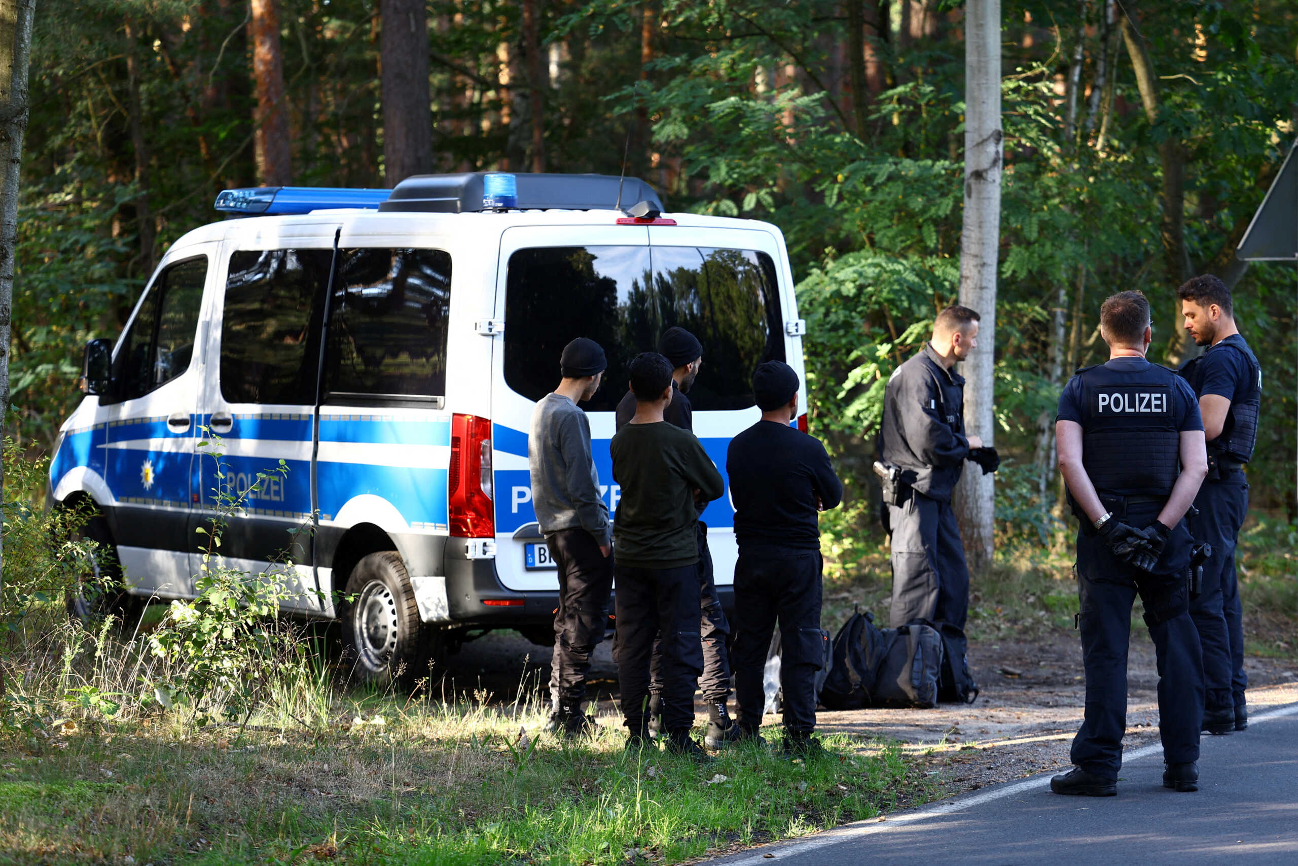 FILE PHOTO: Police detain suspects as they patrol along the German-Polish border to prevent illegal migration near Klinge, Germany, September 20, 2023. REUTERS