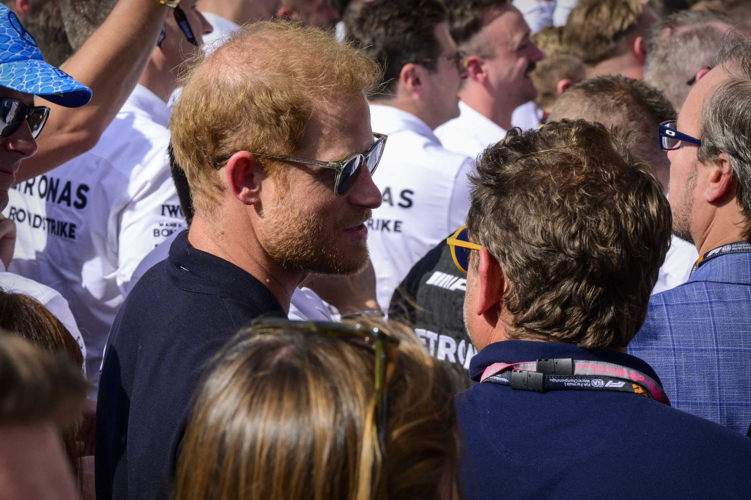 Oct 22, 2023; Austin, Texas, USA; Prince Harry Duke of Sussex watches the celebration after the 2023 United States Grand Prix at Circuit of the Americas. Mandatory Credit: Jerome Miron-USA TODAY Sports
