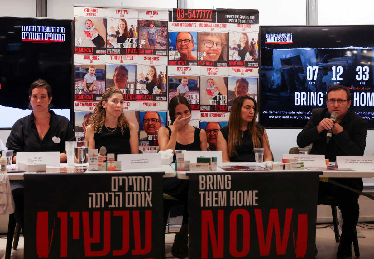 Professor Hagai Levine, head of medicine and contact person for the Red Cross, who heads a humanitarian mission, speaks at a press conference held by the families of people who are missing or were abducted from Israel, following a deadly infiltration by Hamas gunmen from the Gaza Strip, asking for a humanitarian corridor for the transfer of medicine and humanitarian aid for captives who require life-saving medical treatment, in Tel Aviv, Israel, October 14, 2023. REUTERS