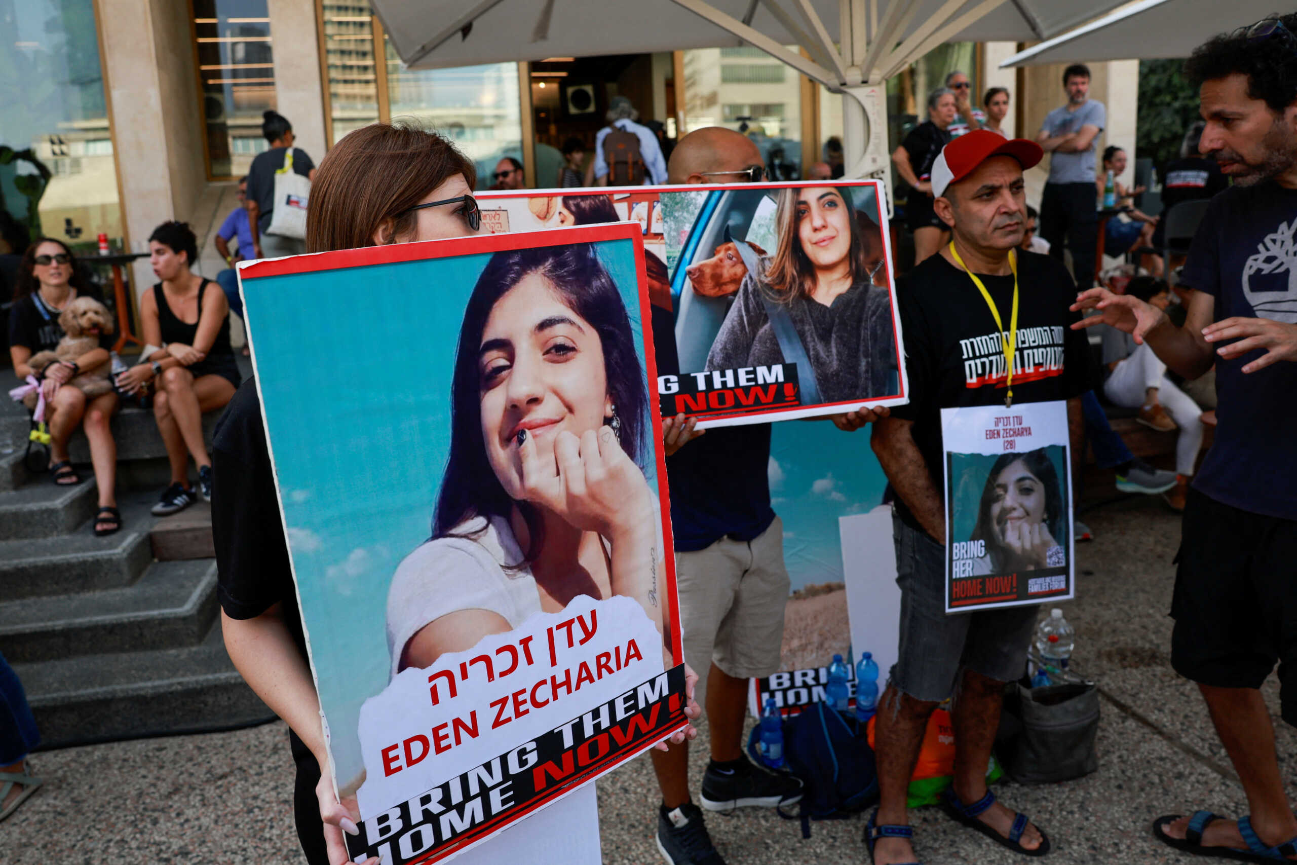 People hold pictures of missing persons during a demonstration by family members and supporters of hostages who are being held in Gaza after they were kidnapped from Israel by Hamas gunmen, as they call for a dialogue with Israeli Prime Minister Benjamin Netanyahu and Defence Minister Yoav Gallant, in Tel Aviv, Israel October 28, 2023. REUTERS