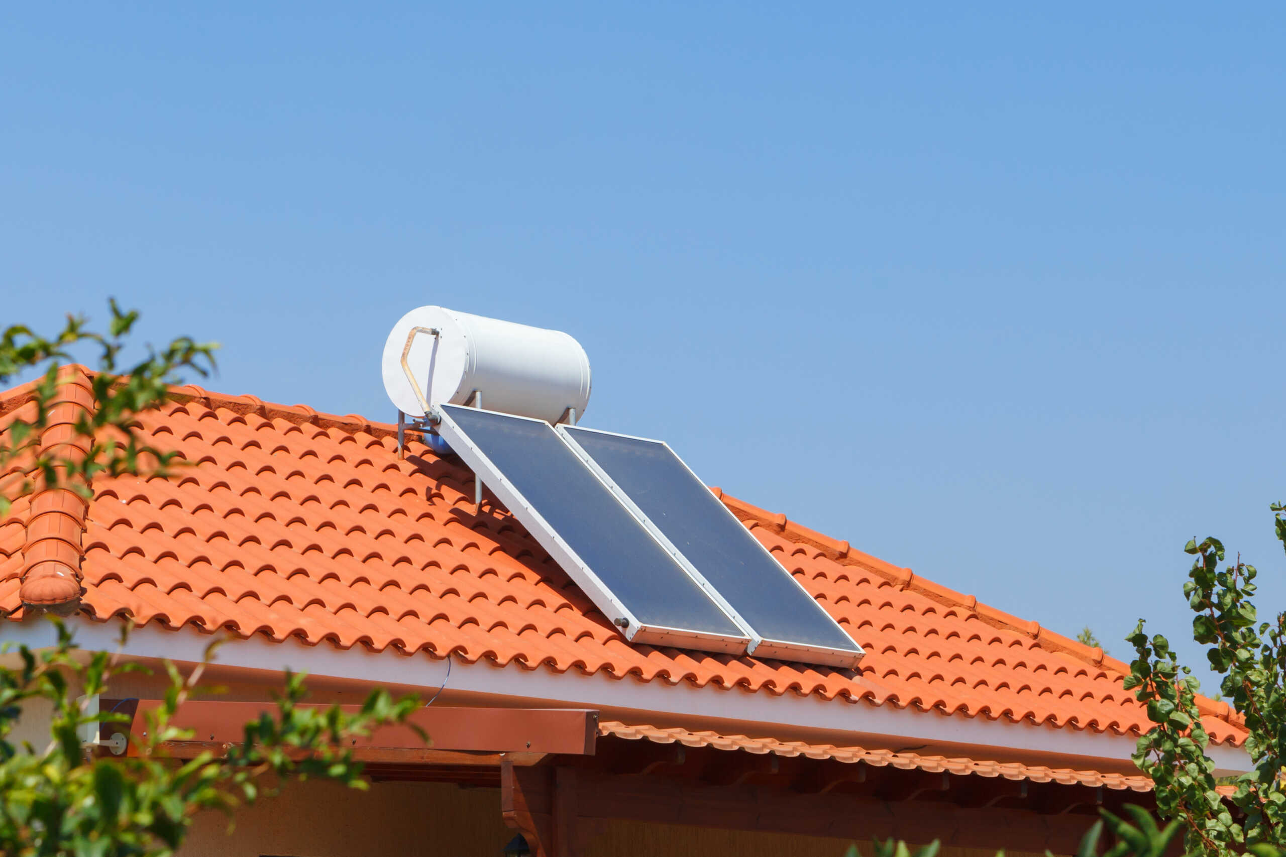 Solar water heating panel and water collector on a house roof