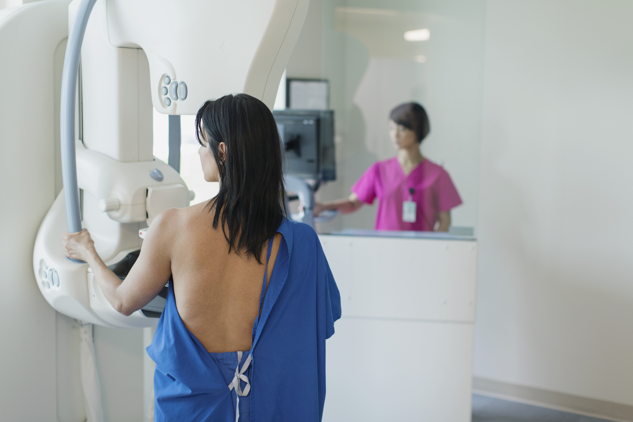 female patient having annual mammograph