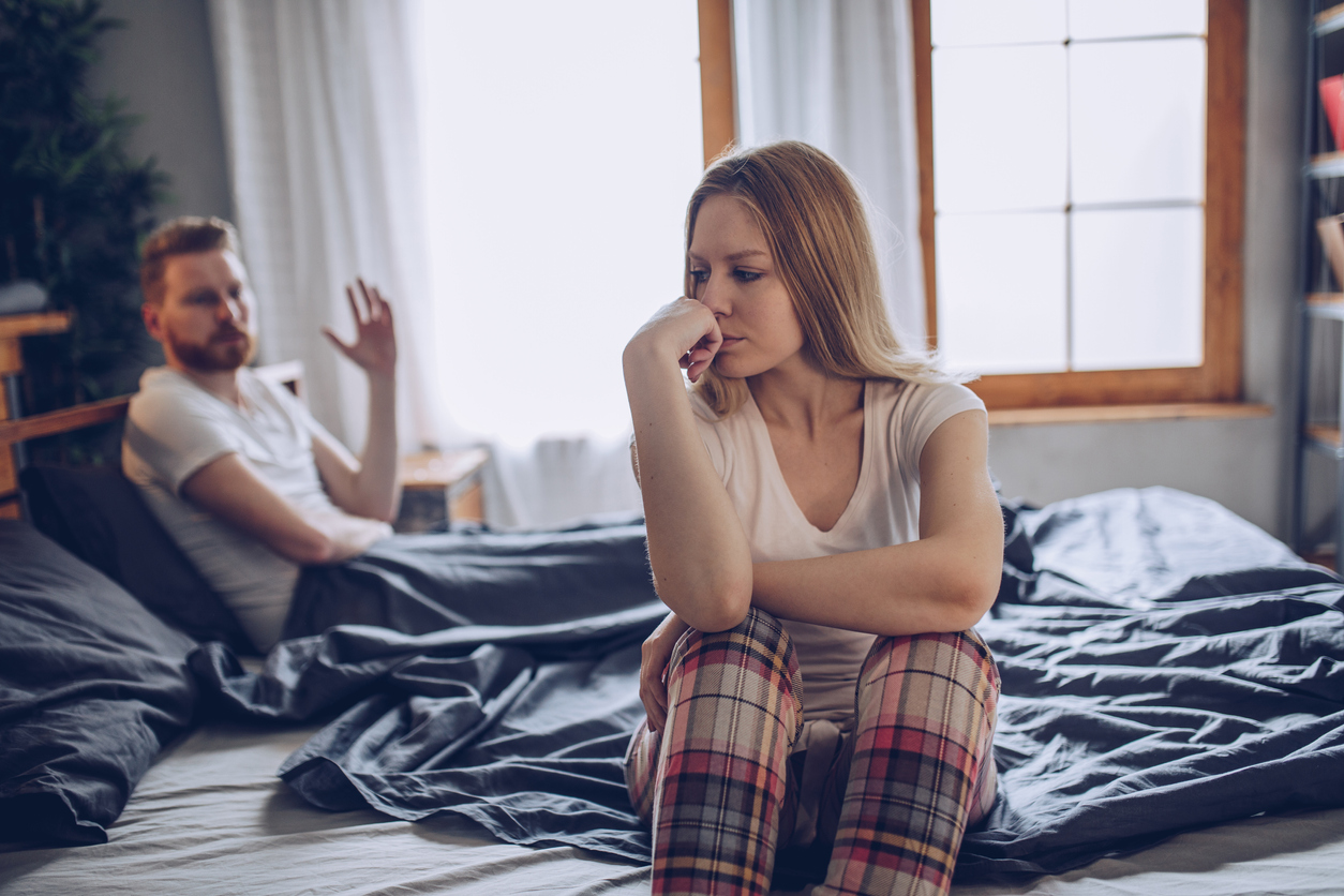 Couple having arguments and sexual problems in bed