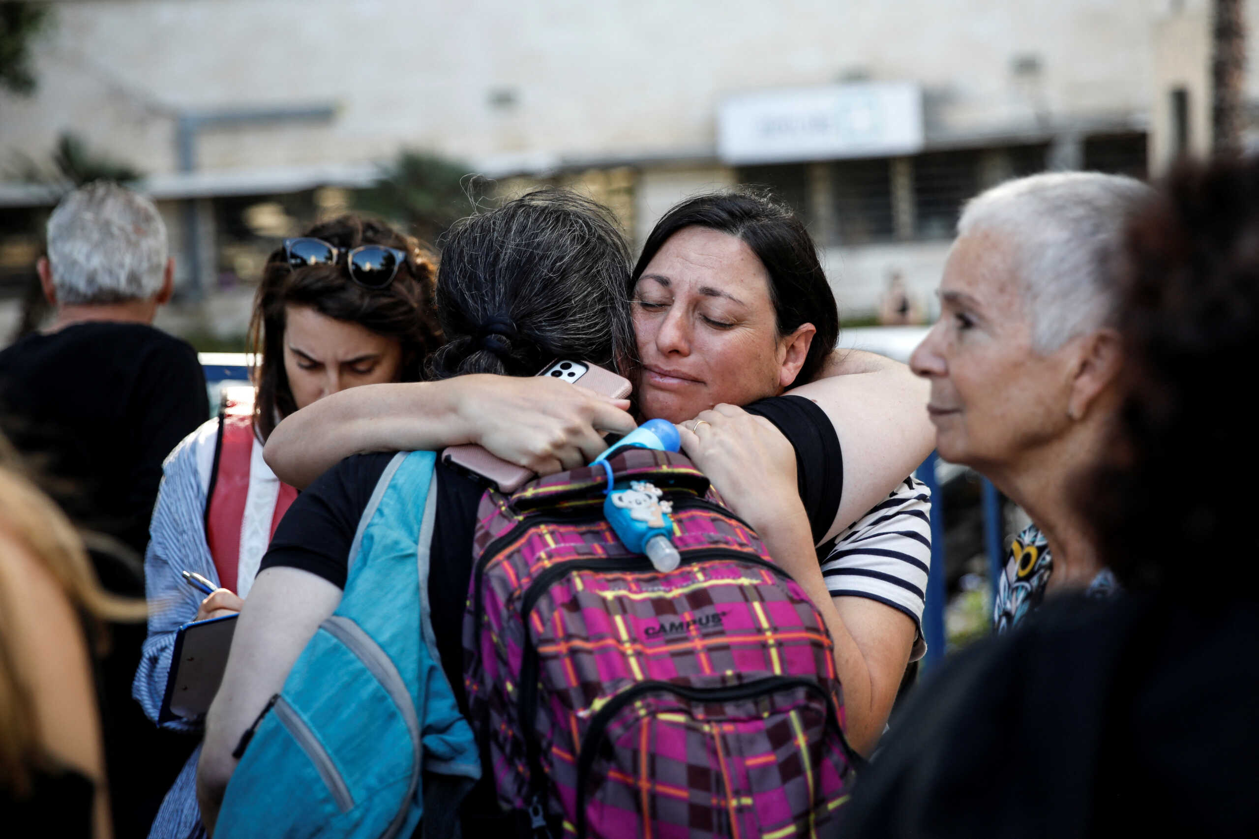 Women embrace as U.S. nationals and their immediate family members wait before leaving Israel on a ship headed for Cyprus, amid the ongoing conflict between Israel and the Palestinian Islamist group Hamas, in Haifa, Israel, October 16, 2023. REUTERS