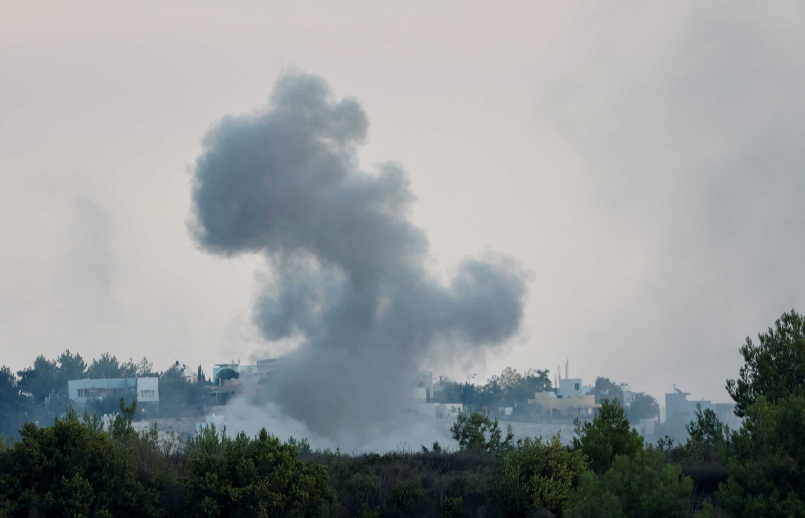 Smoke rises after Israeli shelling , as seen from Lebanese side, near the border with Israel, in Alma Al-Shaab, southern Lebanon, October 13, 2023. REUTERS