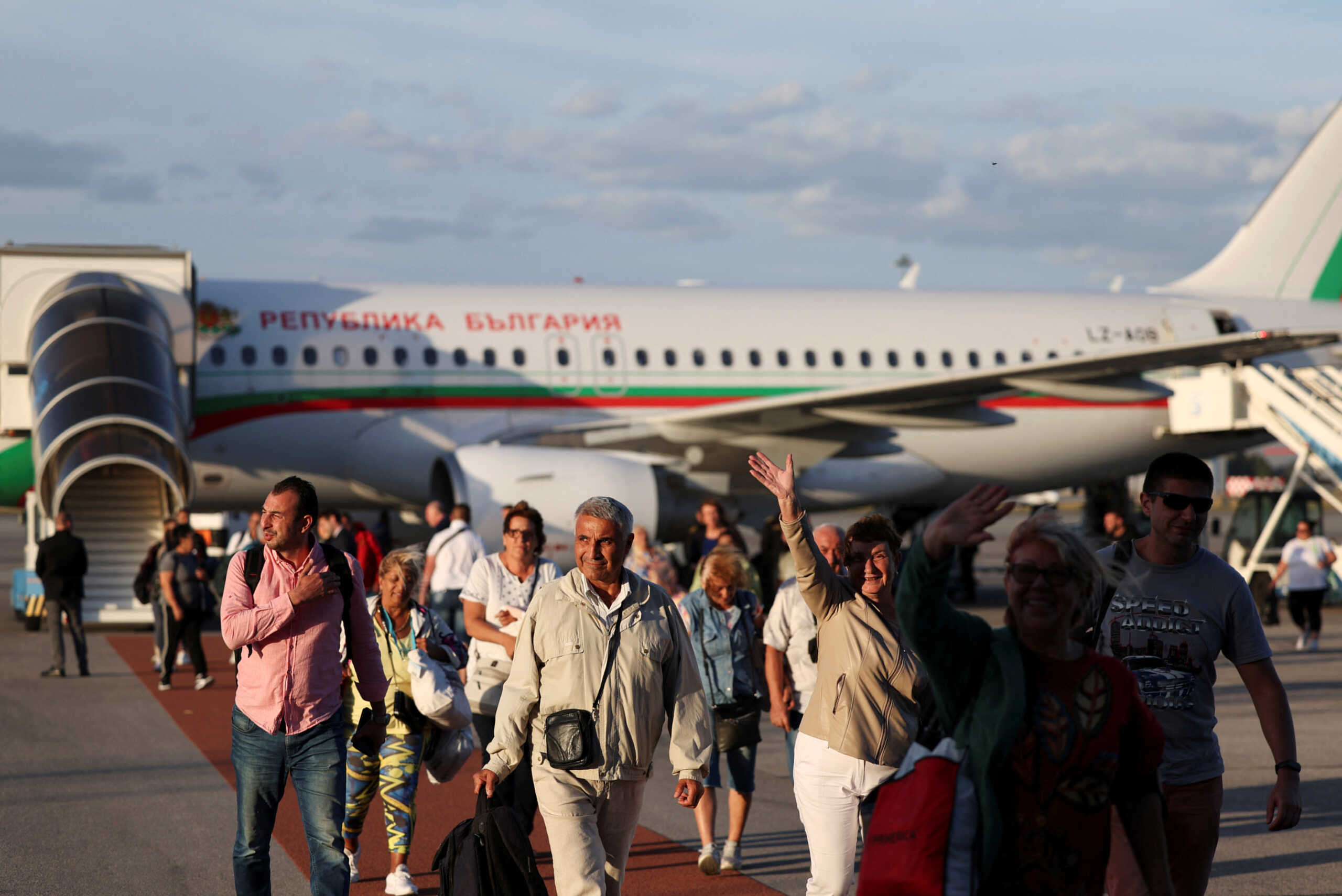 People evacuated from Israel on a Bulgarian government plane react after arriving at Sofia International Airport, in Sofia, Bulgaria, October 8, 2023. REUTERS