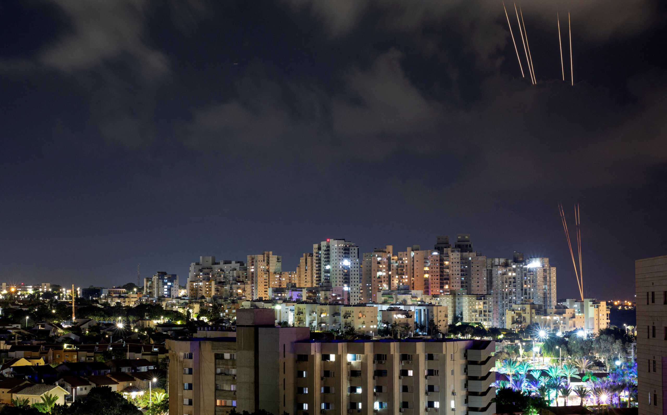 Rockets are launched from the Gaza Strip towards Israel, as seen from Ashkelon, in southern Israel, October 13, 2023. REUTERS